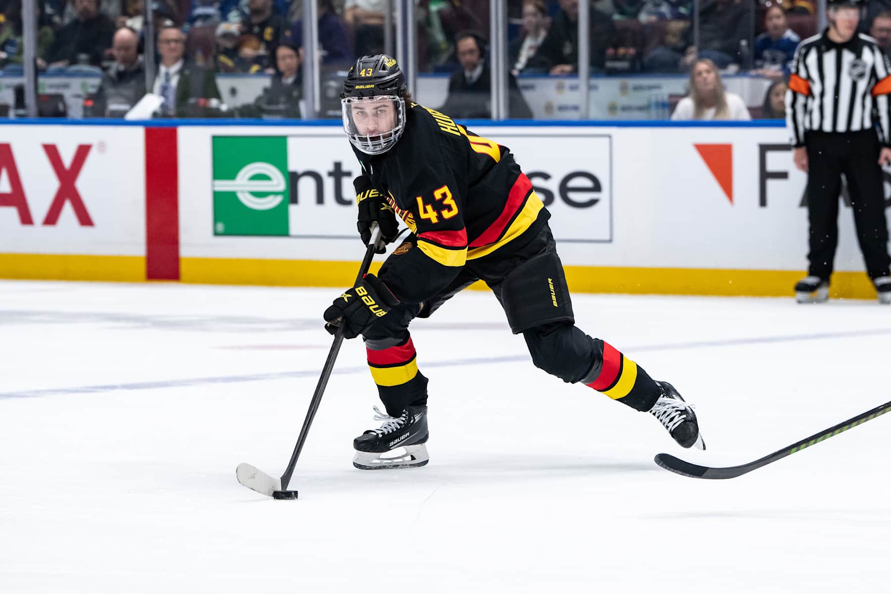 VANCOUVER, BC - DECEMBER 08: Vancouver Canucks defenseman Quinn Hughes (43) skates with the puck during the first period of an NHL game between the Tampa Bay Lightning and the Vancouver Canucks on Sunday, December 8, 2024 at Rogers Arena in Vancouver, B.C. (Photo by Ethan Cairns/Icon Sportswire via Getty Images)