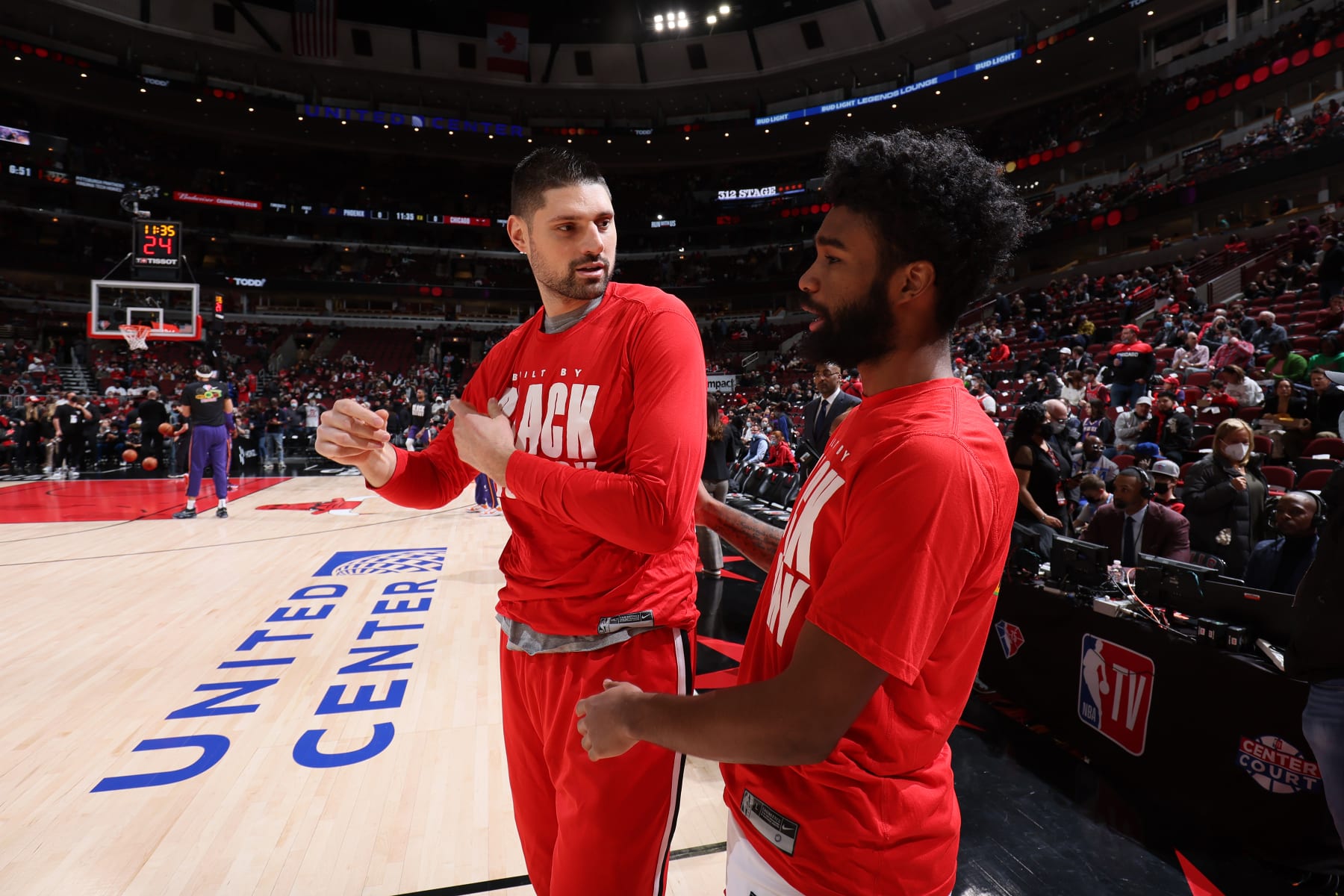 CHICAGO, IL - FEBRUARY 7: Nikola Vucevic #9 and Coby White #0 of the Chicago Bulls talk before the game against the Phoenix Suns on February 7, 2022 at United Center in Chicago, Illinois. NOTE TO USER: User expressly acknowledges and agrees that, by downloading and or using this photograph, User is consenting to the terms and conditions of the Getty Images License Agreement. Mandatory Copyright Notice: Copyright 2022 NBAE (Photo by Jeff Haynes/NBAE via Getty Images)