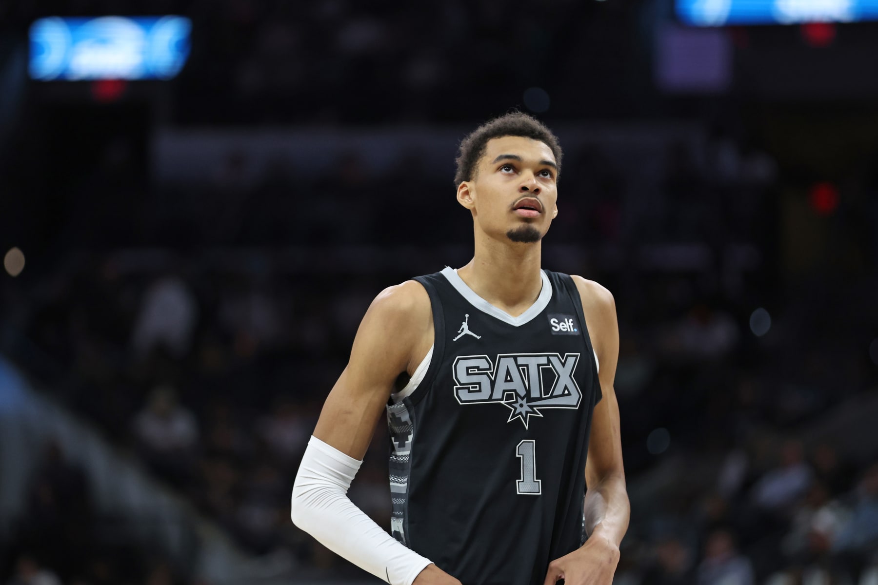 SAN ANTONIO, TX - APRIL 7: Victor Wembanyama #1 of the San Antonio Spurs looks on during the game against the Philadelphia 76ers on April 7, 2024 at the Frost Bank Center in San Antonio, Texas. NOTE TO USER: User expressly acknowledges and agrees that, by downloading and or using this photograph, user is consenting to the terms and conditions of the Getty Images License Agreement. Mandatory Copyright Notice: Copyright 2024 NBAE (Photos by Tim Heitman/NBAE via Getty Images)