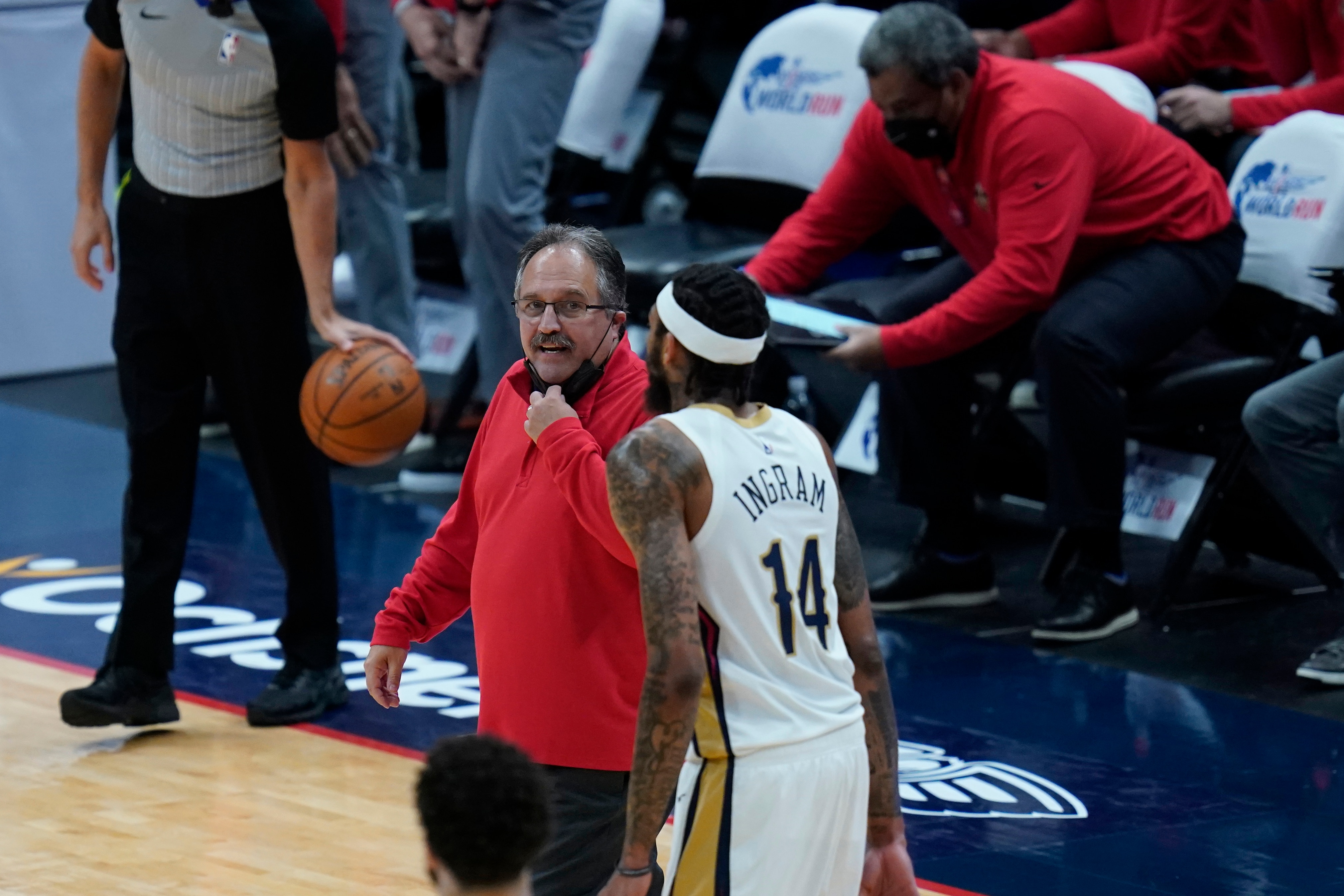 New Orleans Pelicans head coach Stan Van Gundy talks to forward Brandon Ingram (14) during a timeout in the first half of an NBA basketball game against the LA Clippers in New Orleans, Monday, April 26, 2021. (AP Photo/Gerald Herbert)