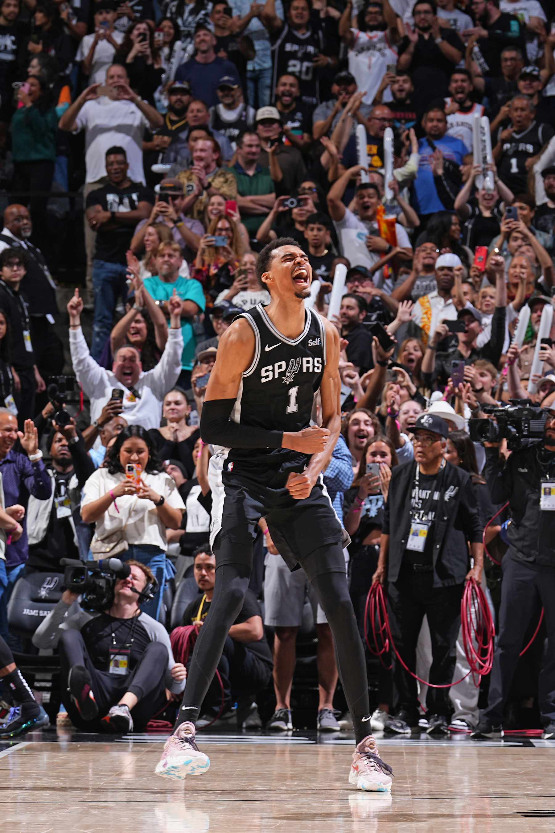 SAN ANTONIO, TX - APRIL 12: Victor Wembanyama #1 of the San Antonio Spurs celebrates during the game against the Denver Nuggets on April 12, 2024 at the Frost Bank Center in San Antonio, Texas. NOTE TO USER: User expressly acknowledges and agrees that, by downloading and or using this photograph, user is consenting to the terms and conditions of the Getty Images License Agreement. Mandatory Copyright Notice: Copyright 2024 NBAE (Photos by Garrett Ellwood/NBAE via Getty Images)