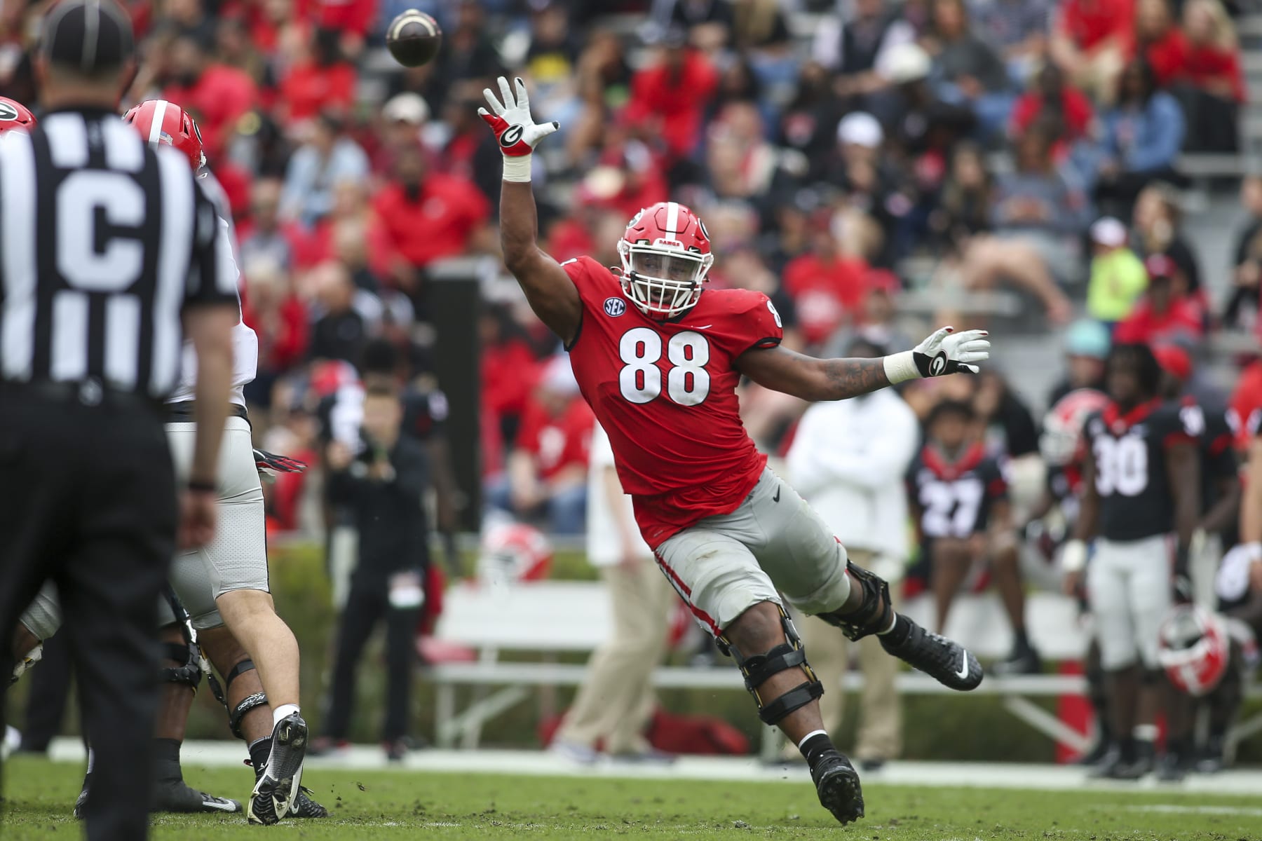 FILE - Georgia defensive lineman Jalen Carter (88) reaches for a ball in the second half of Georgia's spring NCAA college football game, Saturday, April 16, 2022, in Athens, Ga. Carter was named to the Associated Press preseason All-America team, Monday, Aug. 22, 2022. (AP Photo/Brett Davis, File)