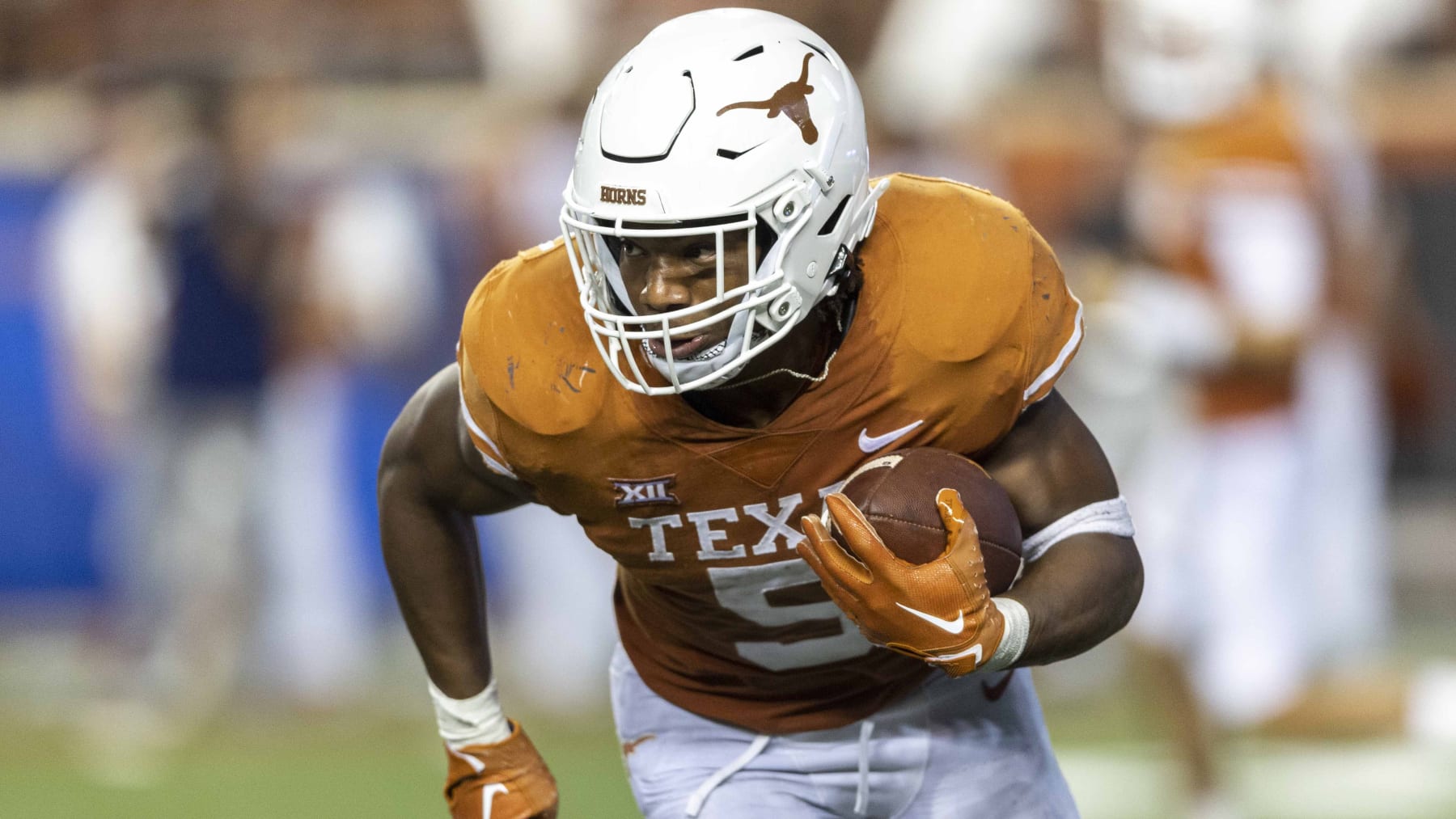 Texas running back Bijan Robinson (5) looks for more yards against UTSA during the second half of an NCAA football game on Saturday, Sept. 17, 2022, in Austin, Texas. (AP Photo/Stephen Spillman)