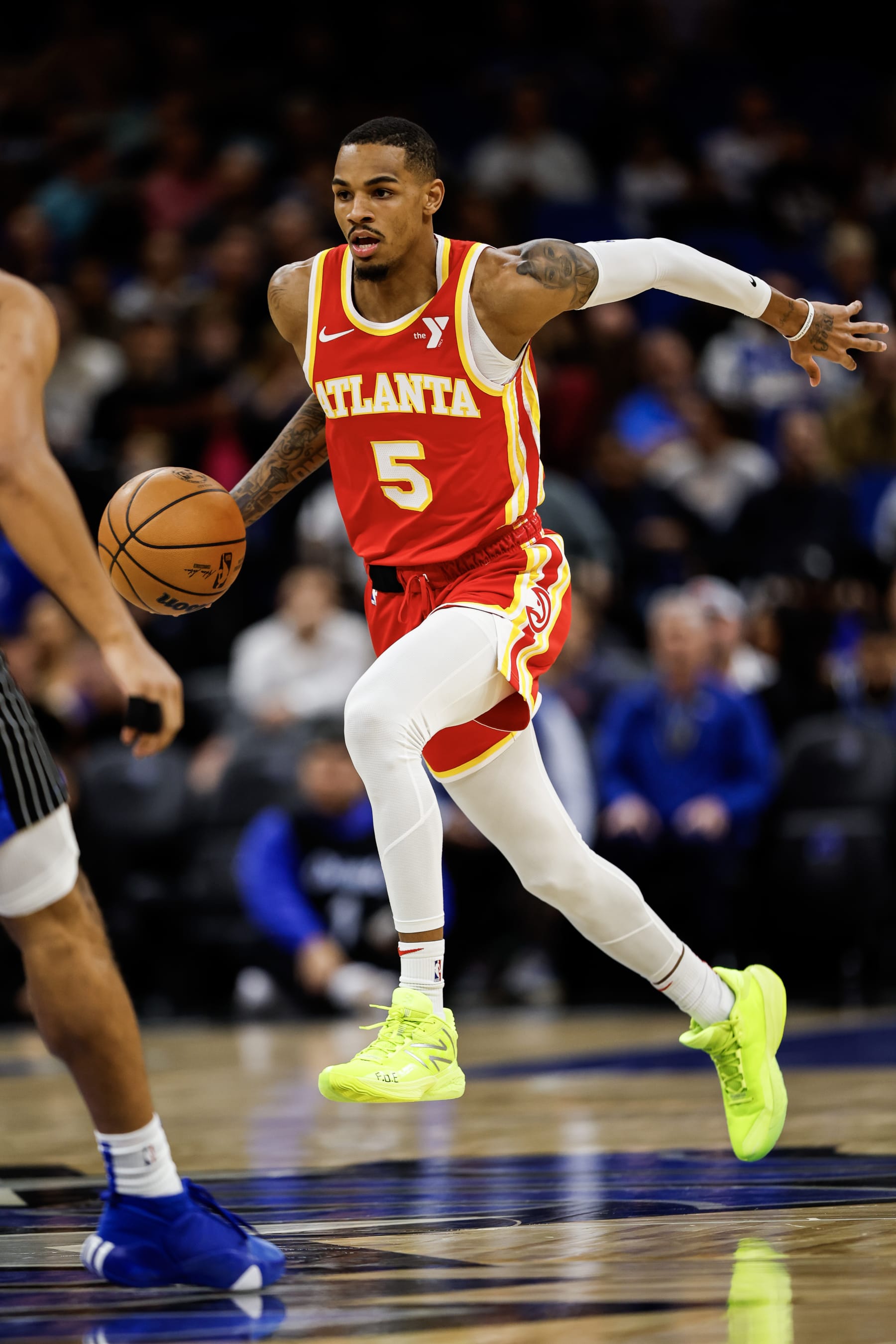 ORLANDO, FLORIDA - JANUARY 07: Dejounte Murray #5 of the Atlanta Hawks dribbles the ball during the first half of a game against the Orlando Magic at the Kia Center on January 07, 2024 in Orlando, Florida. NOTE TO USER: User expressly acknowledges and agrees that, by downloading and or using this photograph, User is consenting to the terms and conditions of the Getty Images License Agreement. (Photo by James Gilbert/Getty Images)