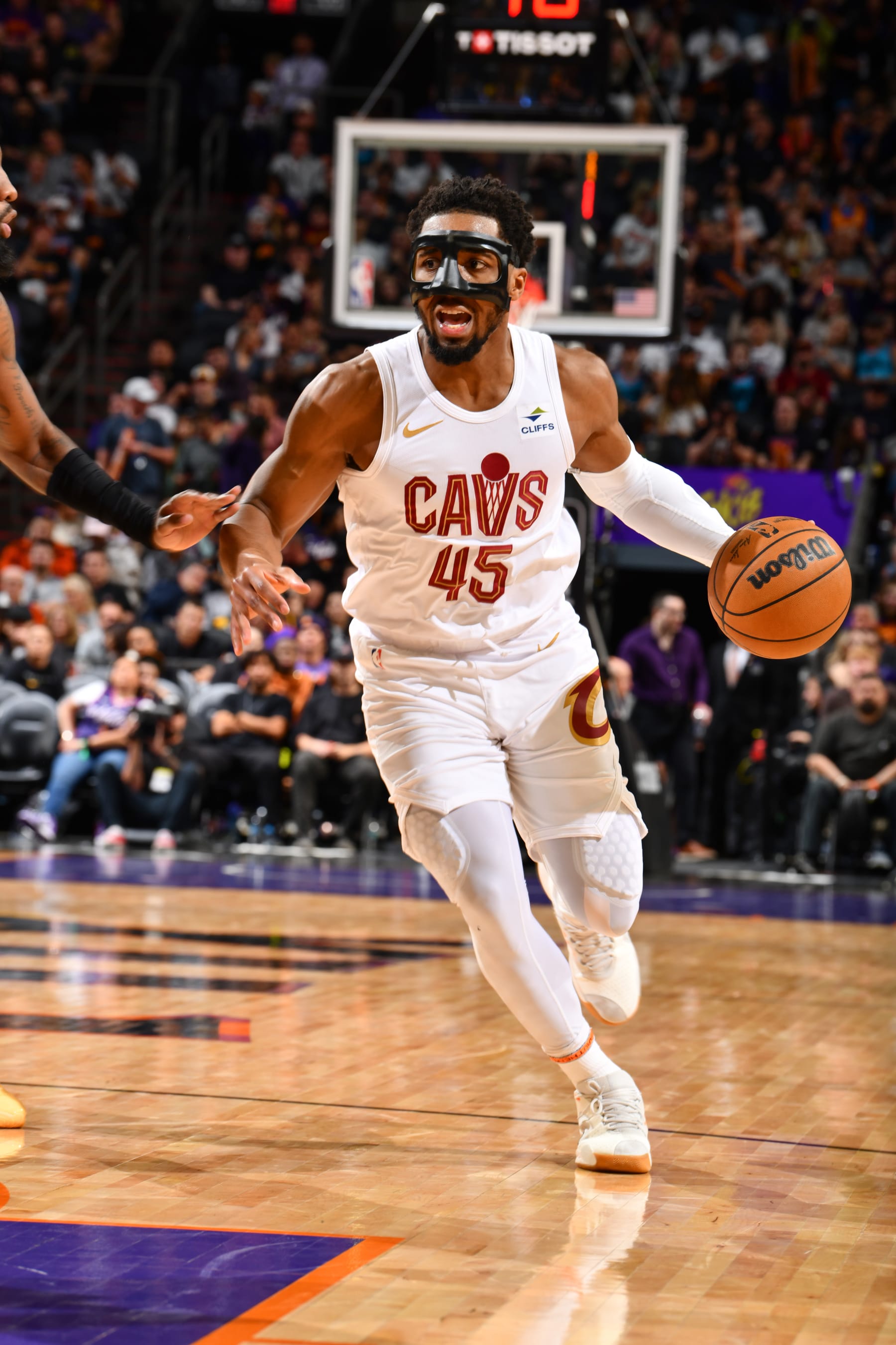 PHOENIX, AZ - APRIL 3:  Donovan Mitchell #45 of the Cleveland Cavaliers handles the ball during the game  on April 3, 2024 at Footprint Center in Phoenix, Arizona. NOTE TO USER: User expressly acknowledges and agrees that, by downloading and or using this photograph, user is consenting to the terms and conditions of the Getty Images License Agreement. Mandatory Copyright Notice: Copyright 2024 NBAE (Photo by Barry Gossage/NBAE via Getty Images)