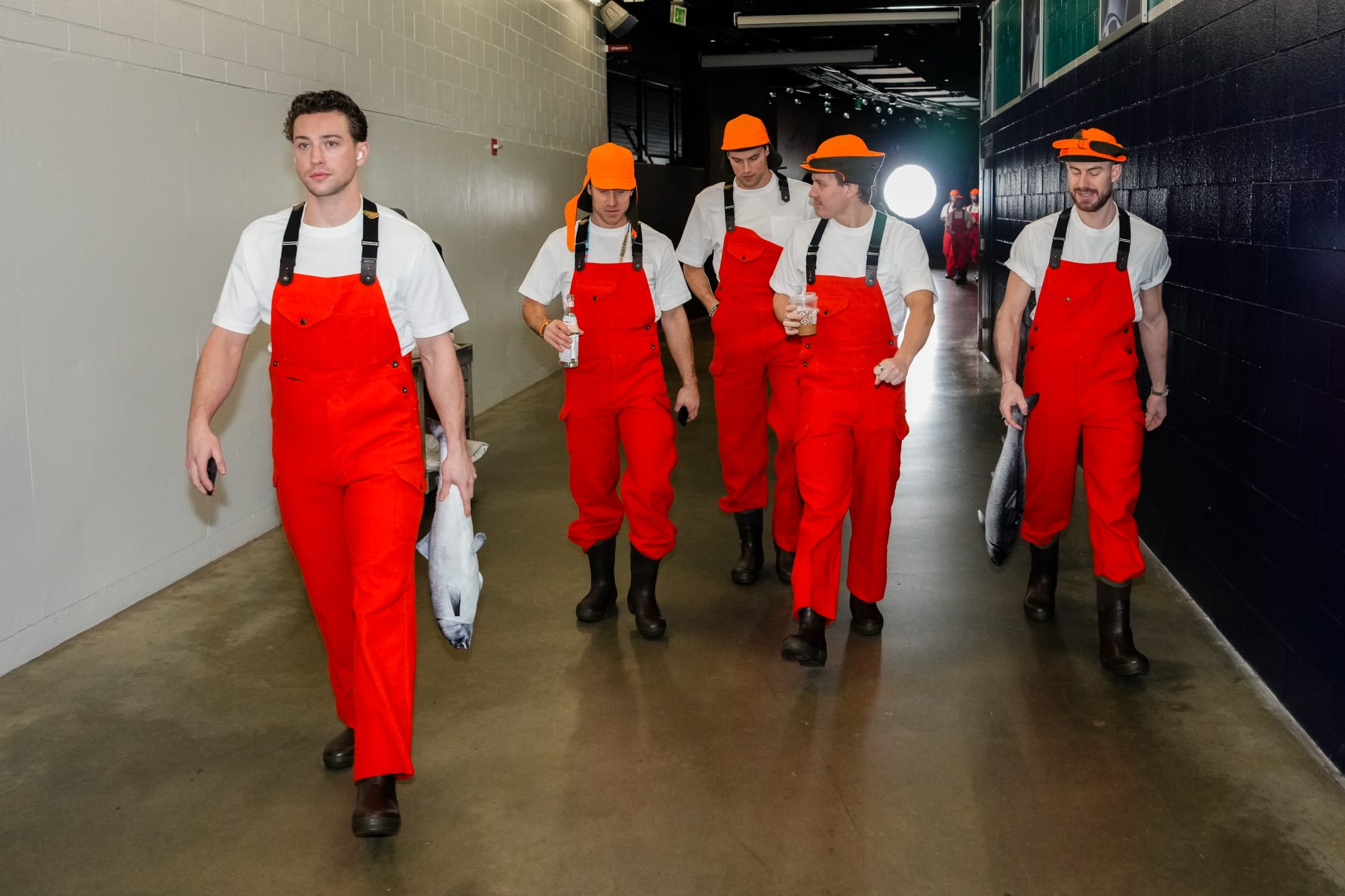 SEATTLE, WASHINGTON - JANUARY 1: Vince Dunn #29, Jaden Schwartz #17, Brian Dumoulin #8, Eeli Tolvanen #20, and Philipp Grubauer #31 of the Seattle Kraken walk to the locker room dressed as Pike Place Market fishmongers ahead of the 2024 Discover NHL Winter Classic against the Vegas Golden Knights at T-Mobile Park on January 1, 2024 in Seattle, Washington. (Photo by Christopher Mast/NHLI via Getty Images) SEATTLE, WASHINGTON - JANUARY 1: Vince Dunn #29, Jaden Schwartz #17, Brian Dumoulin #8, Eeli Tolvanen #20, and Philipp Grubauer #31 of the Seattle Kraken walk to the locker room dressed as Pike Place Market fishmongers ahead of the 2024 Discover NHL Winter Classic against the Vegas Golden Knights at T-Mobile Park on January 1, 2024 in Seattle, Washington. (Photo by Christopher Mast/NHLI via Getty Images)