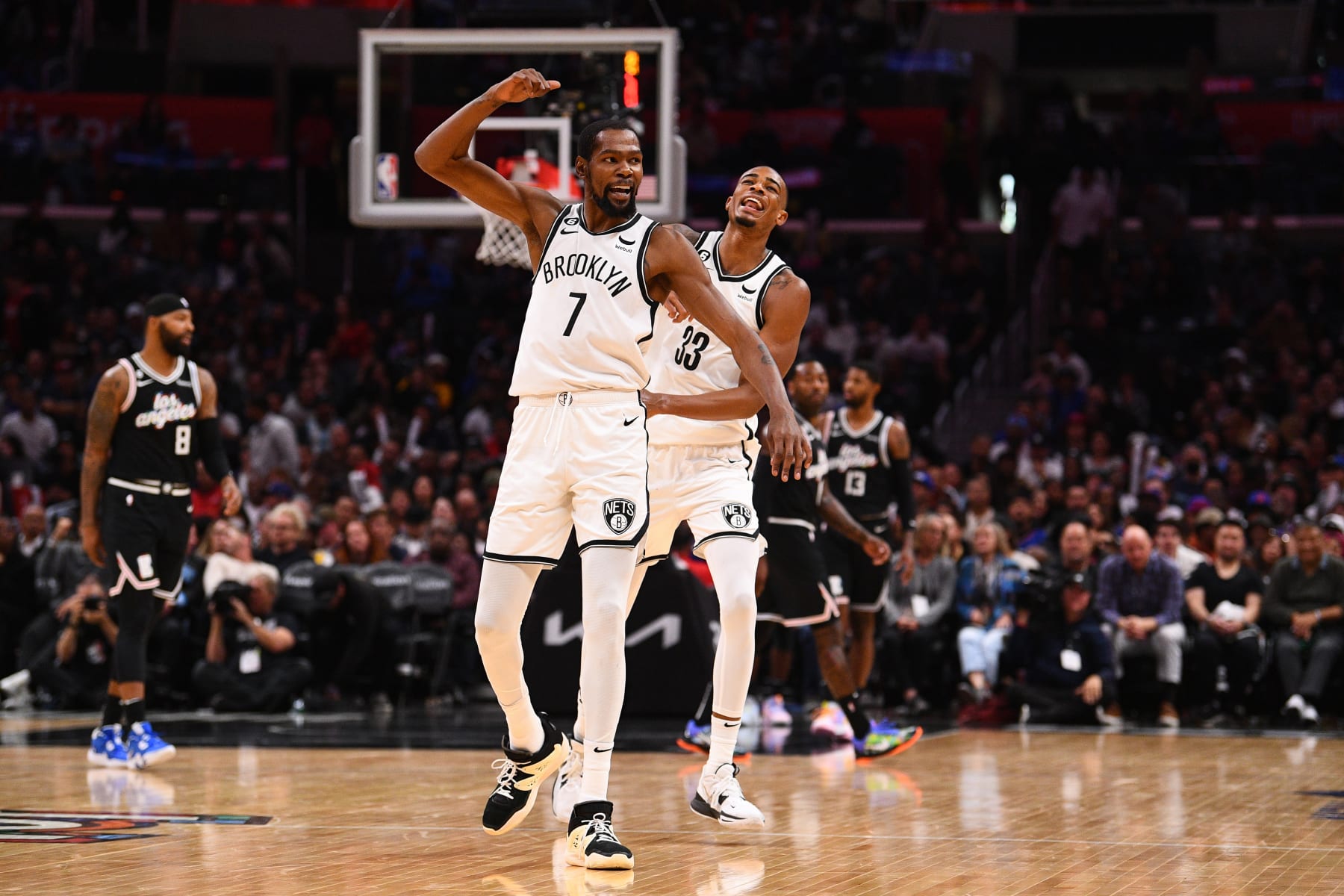 LOS ANGELES, CA - NOVEMBER 12: Brooklyn Nets Forward Kevin Durant (7) and Brooklyn Nets Center Nic Claxton (33) celebrate during a NBA game between the Brooklyn Nets and the Los Angeles Clippers on November 12, 2022 at Crypto.com Arena in Los Angeles, CA. (Photo by Brian Rothmuller/Icon Sportswire via Getty Images)