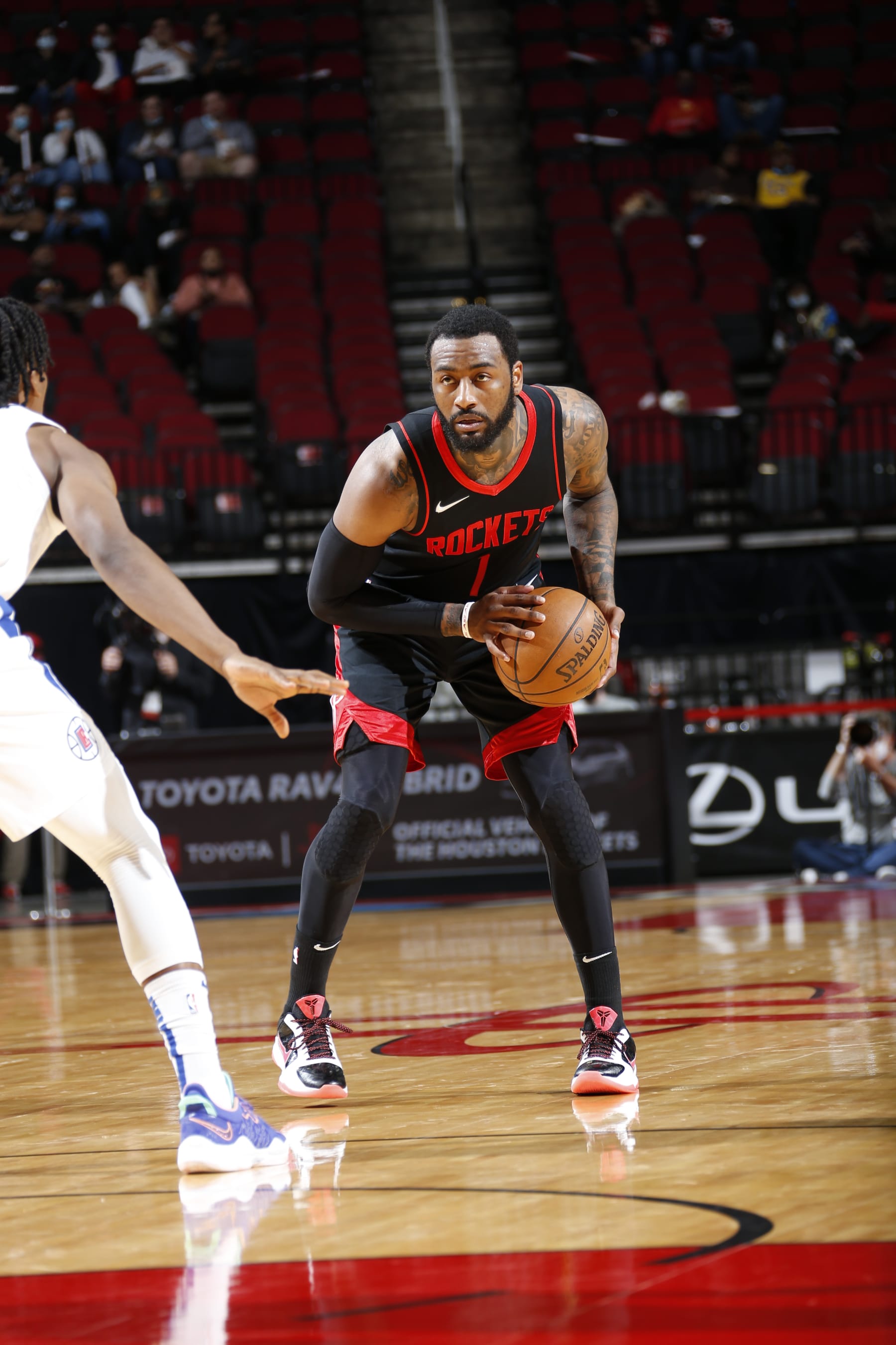 HOUSTON, TX - APRIL 23: John Wall #1 of the Houston Rockets looks on during the game against the Los Angeles Clippers on April 23, 2021 at the Toyota Center in Houston, Texas. NOTE TO USER: User expressly acknowledges and agrees that, by downloading and or using this photograph, User is consenting to the terms and conditions of the Getty Images License Agreement. Mandatory Copyright Notice: Copyright 2021 NBAE (Photo by Troy Fields/NBAE via Getty Images)