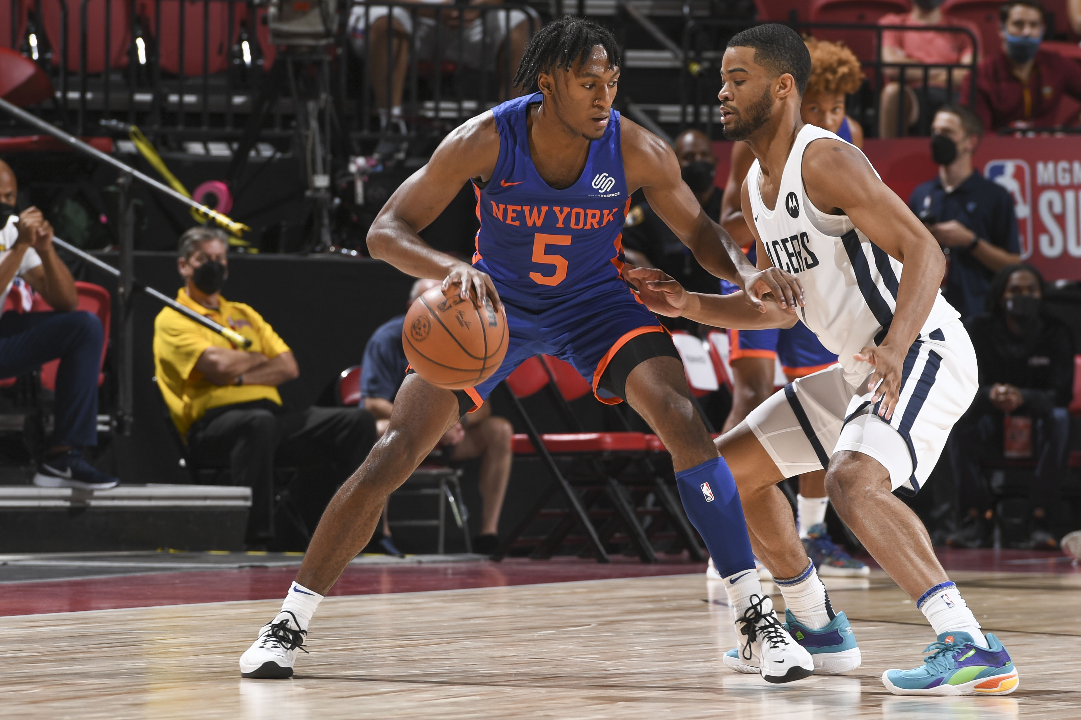 LAS VEGAS, NV - AUGUST 9: Immanuel Quickley #5 of the New York Knicks handles the ball as Cassius Stanley #2 of the Indiana Pacers plays defense during the 2021 Las Vegas Summer League on August 9, 2021 at the Thomas & Mack Center in Las Vegas, Nevada. NOTE TO USER: User expressly acknowledges and agrees that, by downloading and/or using this Photograph, user is consenting to the terms and conditions of the Getty Images License Agreement. Mandatory Copyright Notice: Copyright 2021 NBAE (Photo by Bart Young/NBAE via Getty Images)