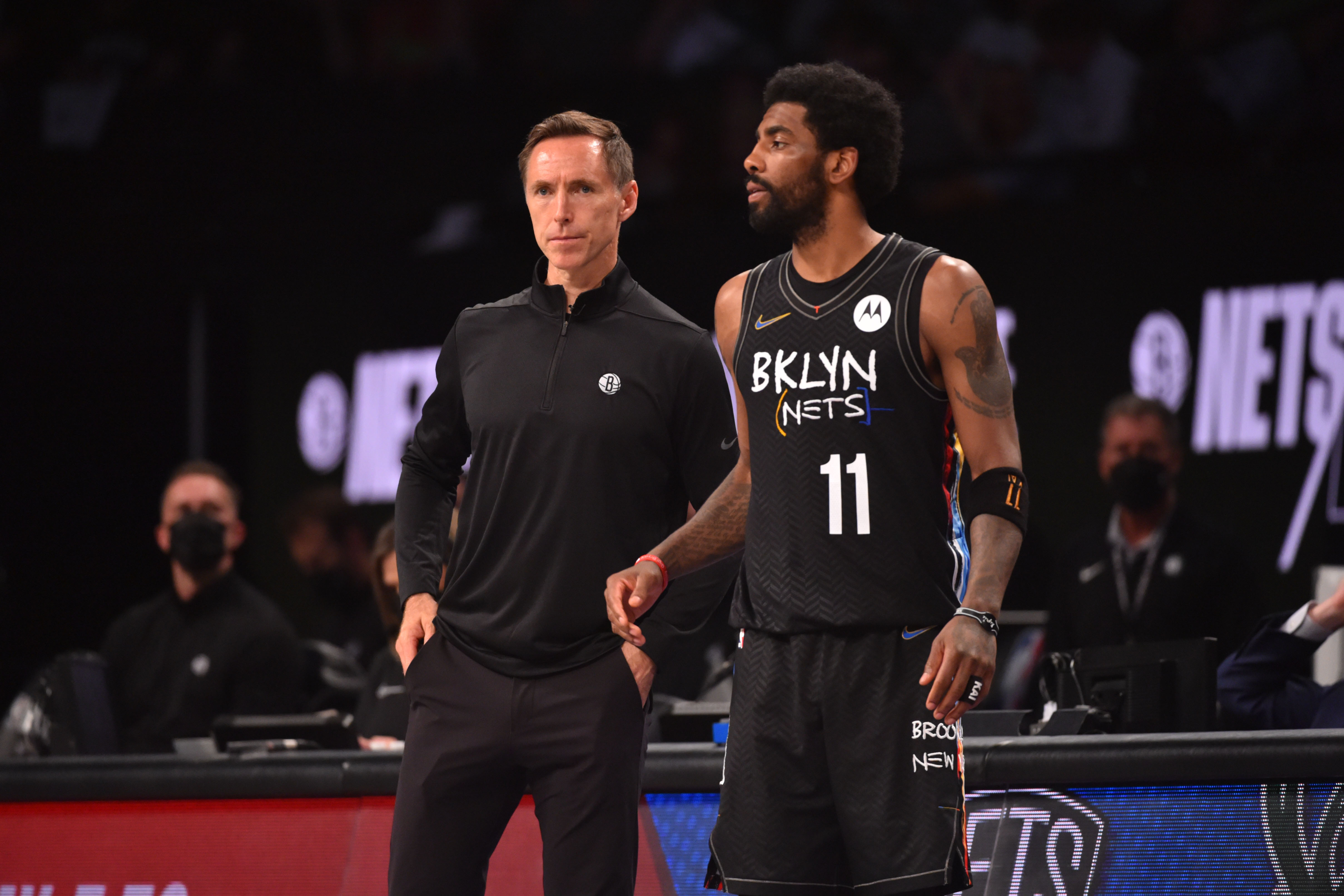 BROOKLYN, NY - JUNE 7: Head Coach Steve Nash of the Brooklyn Nets and Kyrie Irving #11 of the Brooklyn Nets look on during a game against the Milwaukee Bucks during Round 2, Game 2 on June 7, 2021 at Barclays Center in Brooklyn, New York. NOTE TO USER: User expressly acknowledges and agrees that, by downloading and/or using this Photograph, user is consenting to the terms and conditions of the Getty Images License Agreement. Mandatory Copyright Notice: Copyright 2021 NBAE (Photo by Jesse D. Garrabrant/NBAE via Getty Images)