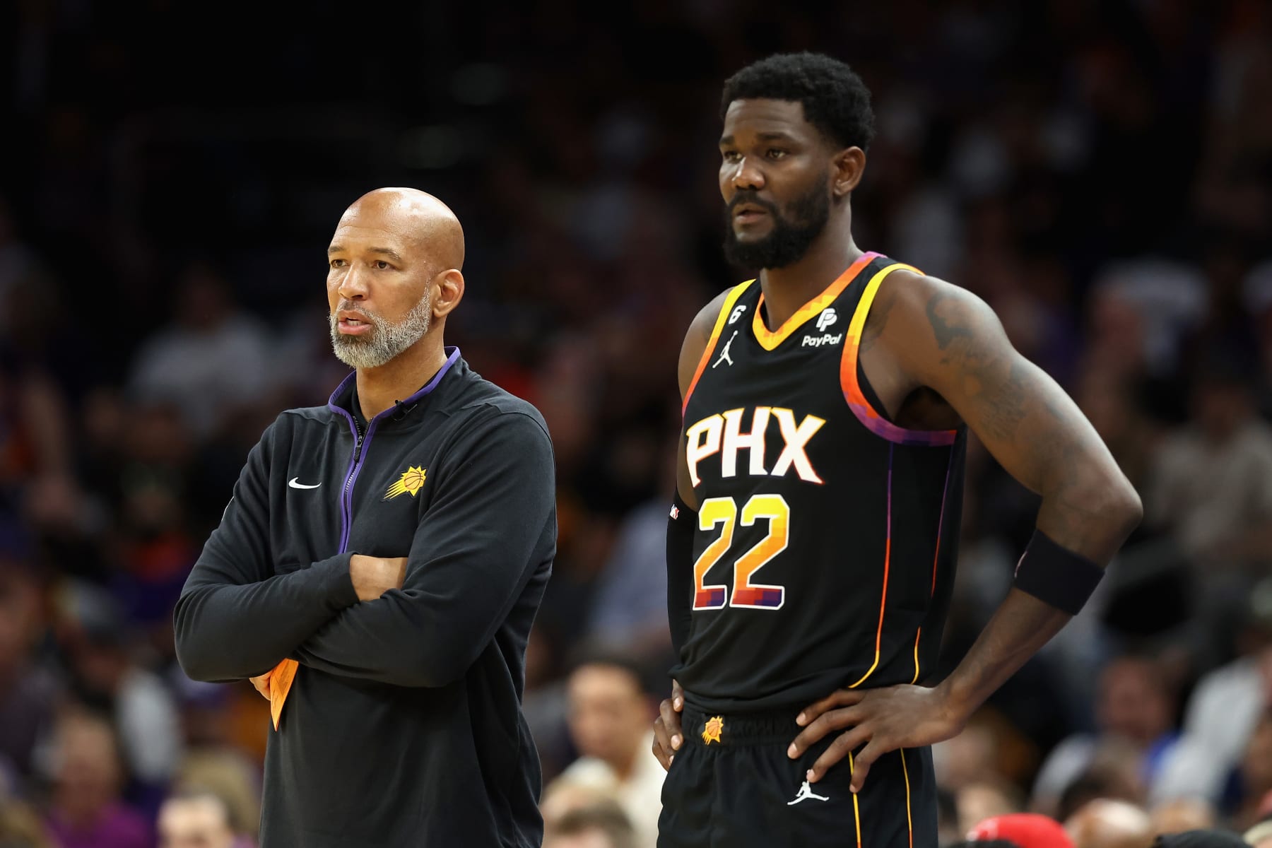 PHOENIX, ARIZONA - OCTOBER 19: Head coach Monty Williams and Deandre Ayton #22 of the Phoenix Suns stand on the sidelines during the first half of the NBA game against the Dallas Mavericks at Footprint Center on October 19, 2022 in Phoenix, Arizona. NOTE TO USER: User expressly acknowledges and agrees that, by downloading and or using this photograph, User is consenting to the terms and conditions of the Getty Images License Agreement.  (Photo by Christian Petersen/Getty Images)