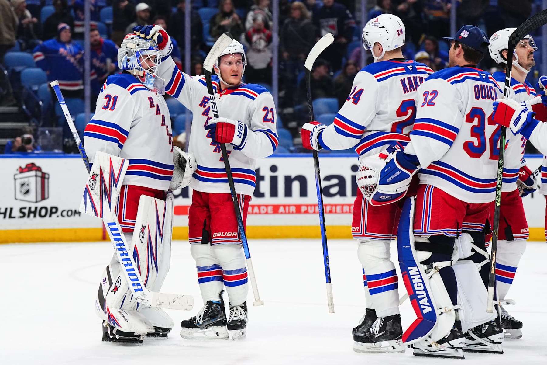 BUFFALO, NEW YORK - DECEMBER 11: (L-R) Igor Shesterkin #31, Adam Fox #23, Kaapo Kakko #24 and Jonathan Quick #32 of the New York Rangers celebrate their win after an NHL game against the Buffalo Sabres on December 11, 2024 at KeyBank Center in Buffalo, New York. (Photo by Chris Conaway Jr./NHLI via Getty Images)