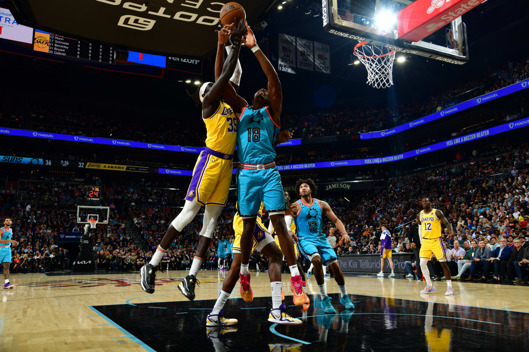 PHOENIX, AZ - NOVEMBER 22: Wenyen Gabriel #35 of the Los Angeles Lakers and Bismack Biyombo #18 of the Phoenix Suns battle for possession of the rebound ball on November 22, 2022 at Footprint Center in Phoenix, Arizona. NOTE TO USER: User expressly acknowledges and agrees that, by downloading and or using this photograph, user is consenting to the terms and conditions of the Getty Images License Agreement. Mandatory Copyright Notice: Copyright 2022 NBAE (Photo by Kate Frese/NBAE via Getty Images)