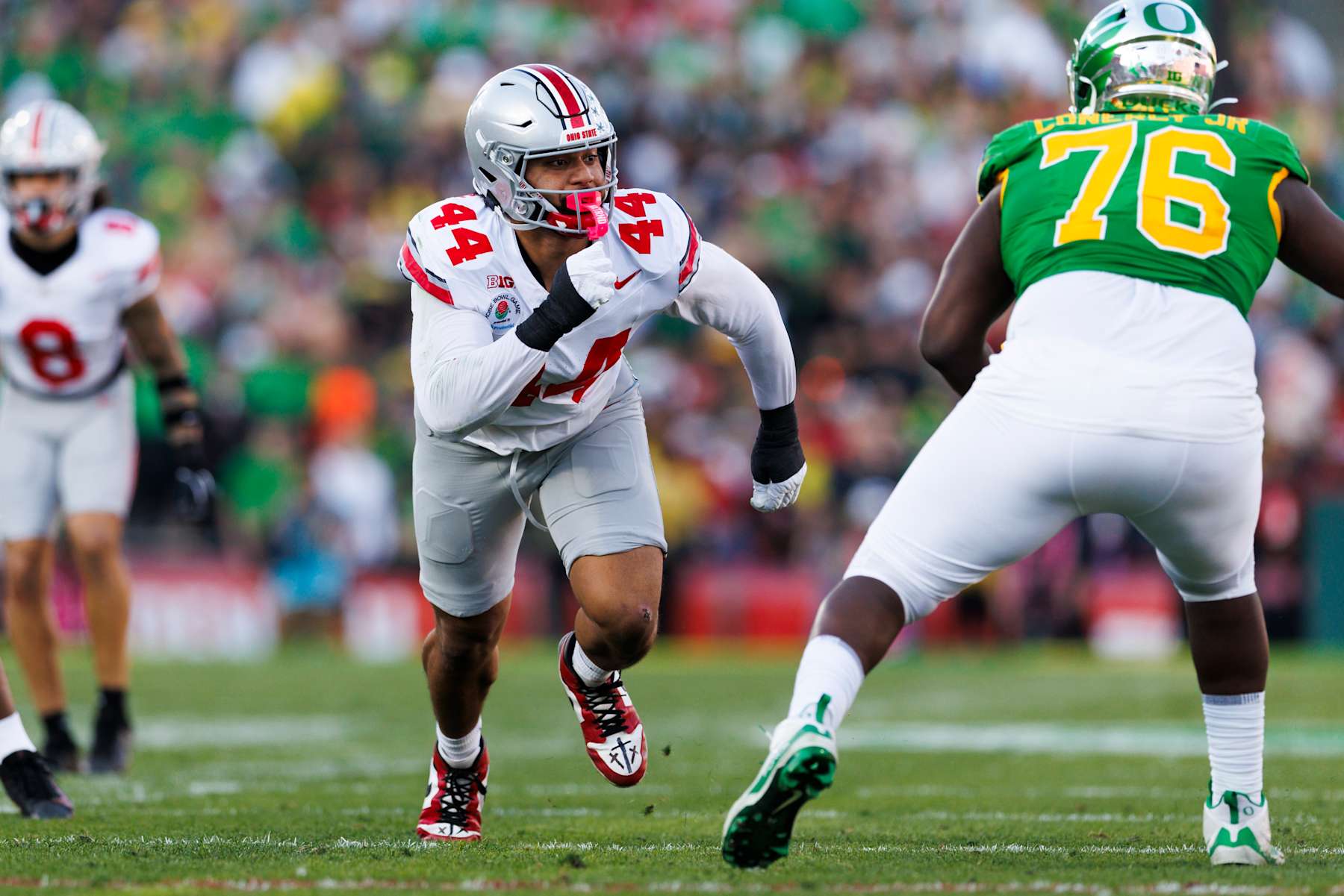 PASADENA, CALIFORNIA - JANUARY 1: JT Tuimoloau #44 of the Ohio State Buckeyes rushes the edge in the first half during the Rose Bowl against Oregon Ducks at Rose Bowl Stadium on January 1, 2025 in Pasadena, California. (Photo by Ric Tapia/Getty Images)