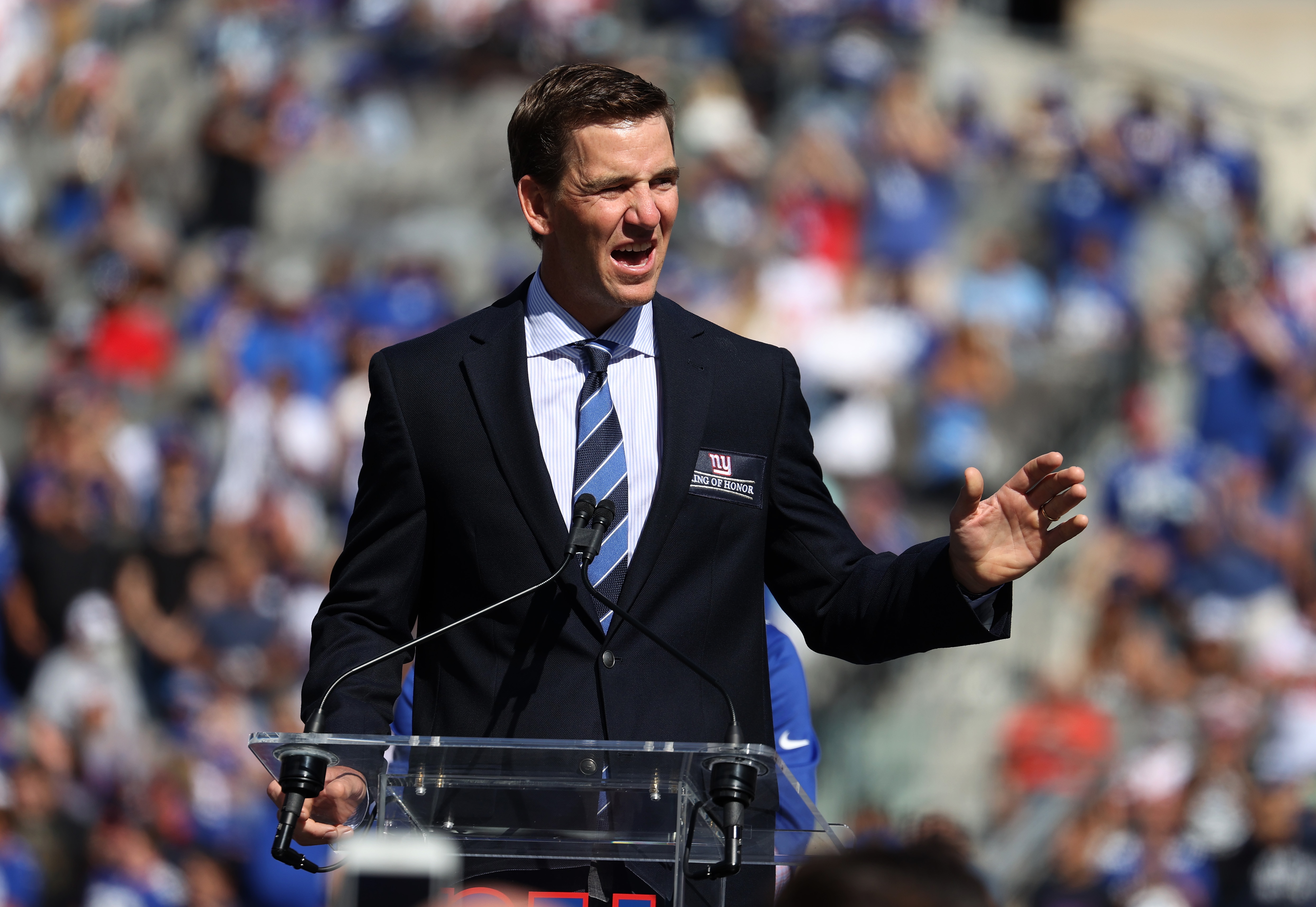 EAST RUTHERFORD, NEW JERSEY - SEPTEMBER 26: Eli Manning of the New York Giants speaks during his ring of honor induction ceremony at halftime of the game between the New York Giants and the Atlanta Falcons at MetLife Stadium on September 26, 2021 in East Rutherford, New Jersey. (Photo by Al Bello/Getty Images)