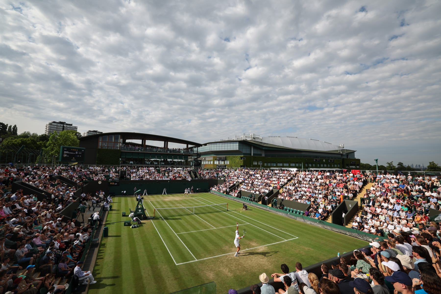 LONDON, ENGLAND - JULY 08: A general view as Holger Rune of Denmark serves against Alejandro Davidovich Fokina on Court 3 in the Men's Singles third round match during day six of The Championships Wimbledon 2023 at All England Lawn Tennis and Croquet Club on July 08, 2023 in London, England. (Photo by Michael Regan/Getty Images)