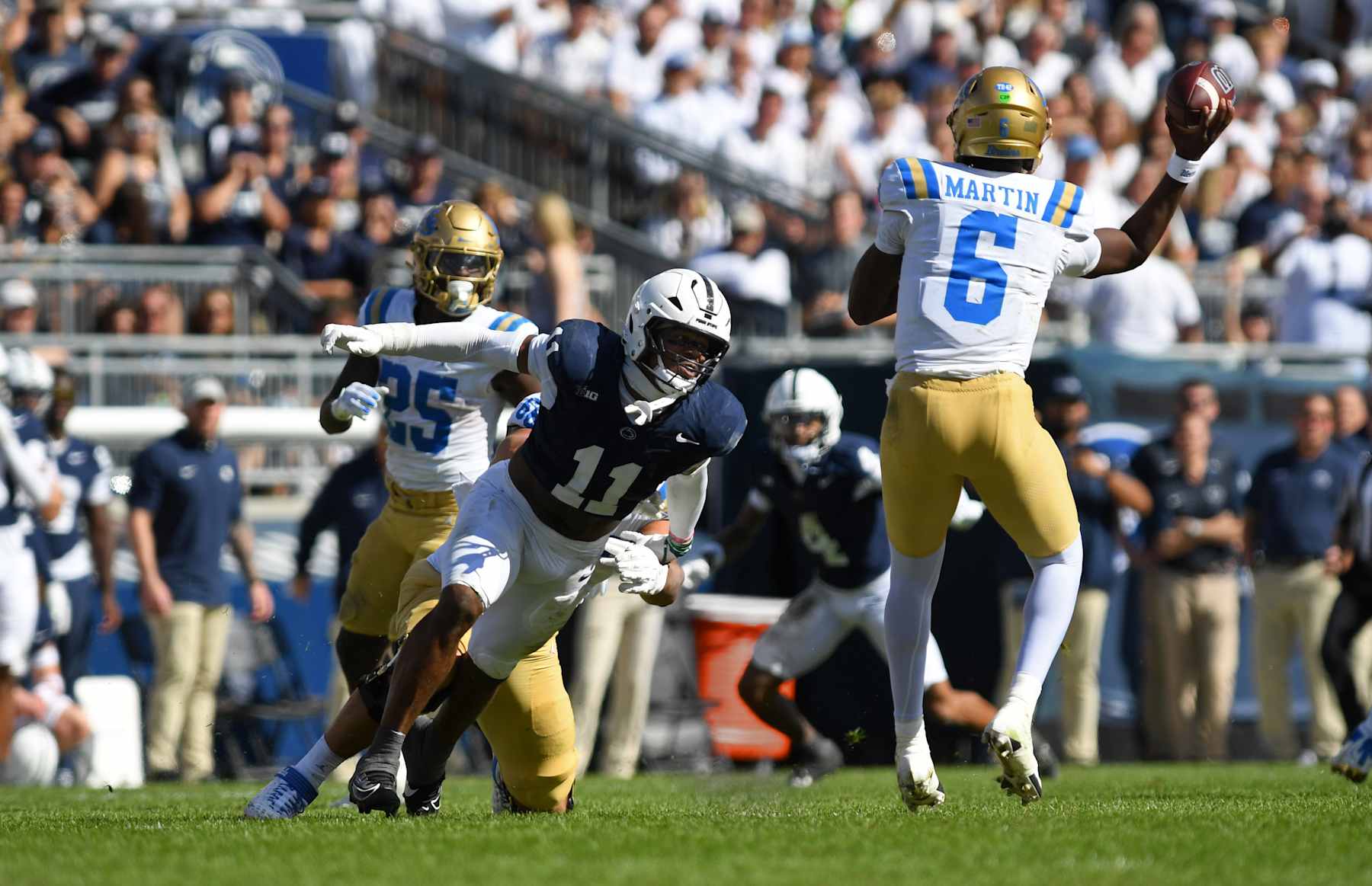 UNIVERSITY PARK, PA - OCTOBER 05: Penn State linebacker Abdul Carter (11) pressures UCLA quarterback Justyn Martin (6) during the UCLA Bruins versus Penn State Nittany Lions game on October 5, 2024 at Beaver Stadium in University Park, PA. (Photo by Randy Litzinger/Icon Sportswire via Getty Images)