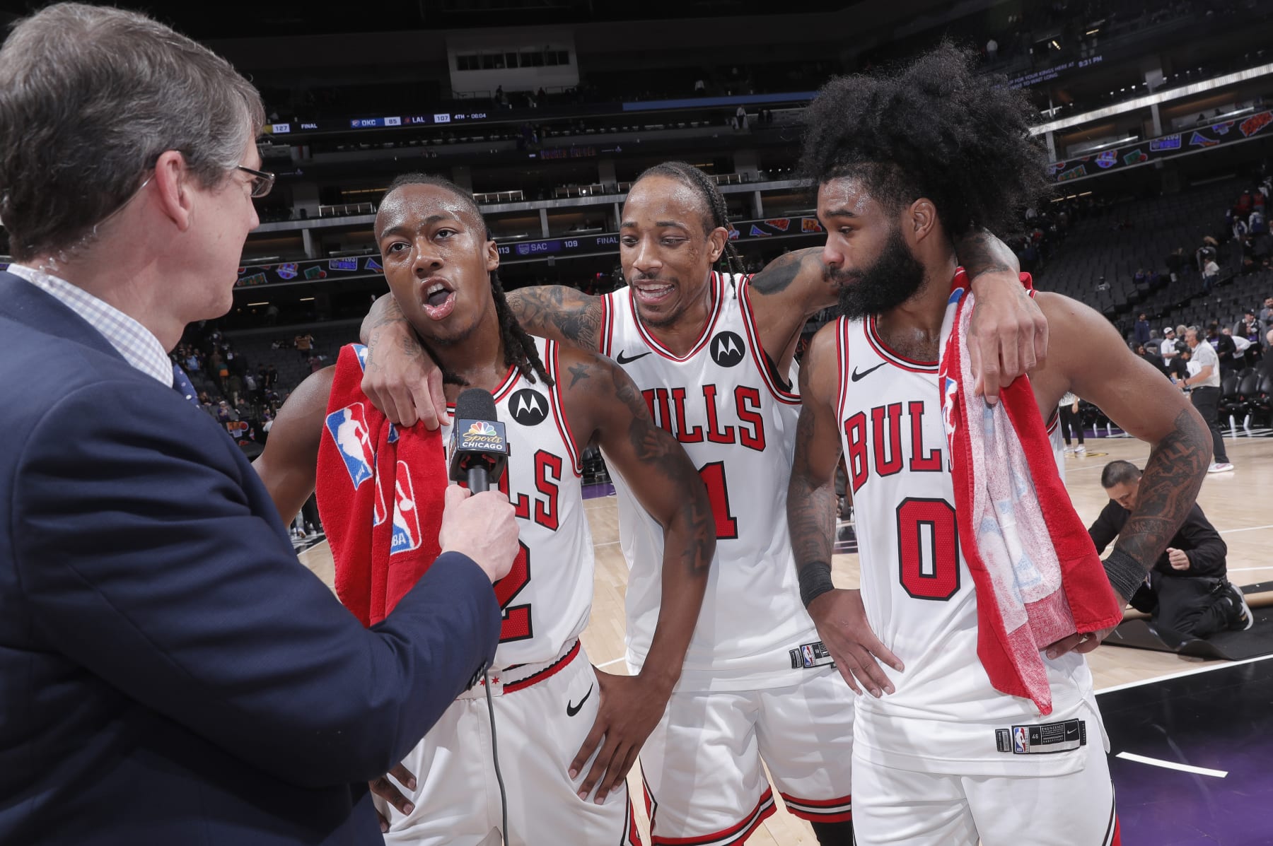 SACRAMENTO, CA - MARCH 4: Ayo Dosunmu #12 of the Chicago Bulls speaks with media while teammates DeMar DeRozan #11 and Coby White #0 look on after defeating the Sacramento Kings on March 4, 2024 at Golden 1 Center in Sacramento, California. NOTE TO USER: User expressly acknowledges and agrees that, by downloading and or using this photograph, User is consenting to the terms and conditions of the Getty Images Agreement. Mandatory Copyright Notice: Copyright 2024 NBAE (Photo by Rocky Widner/NBAE via Getty Images)