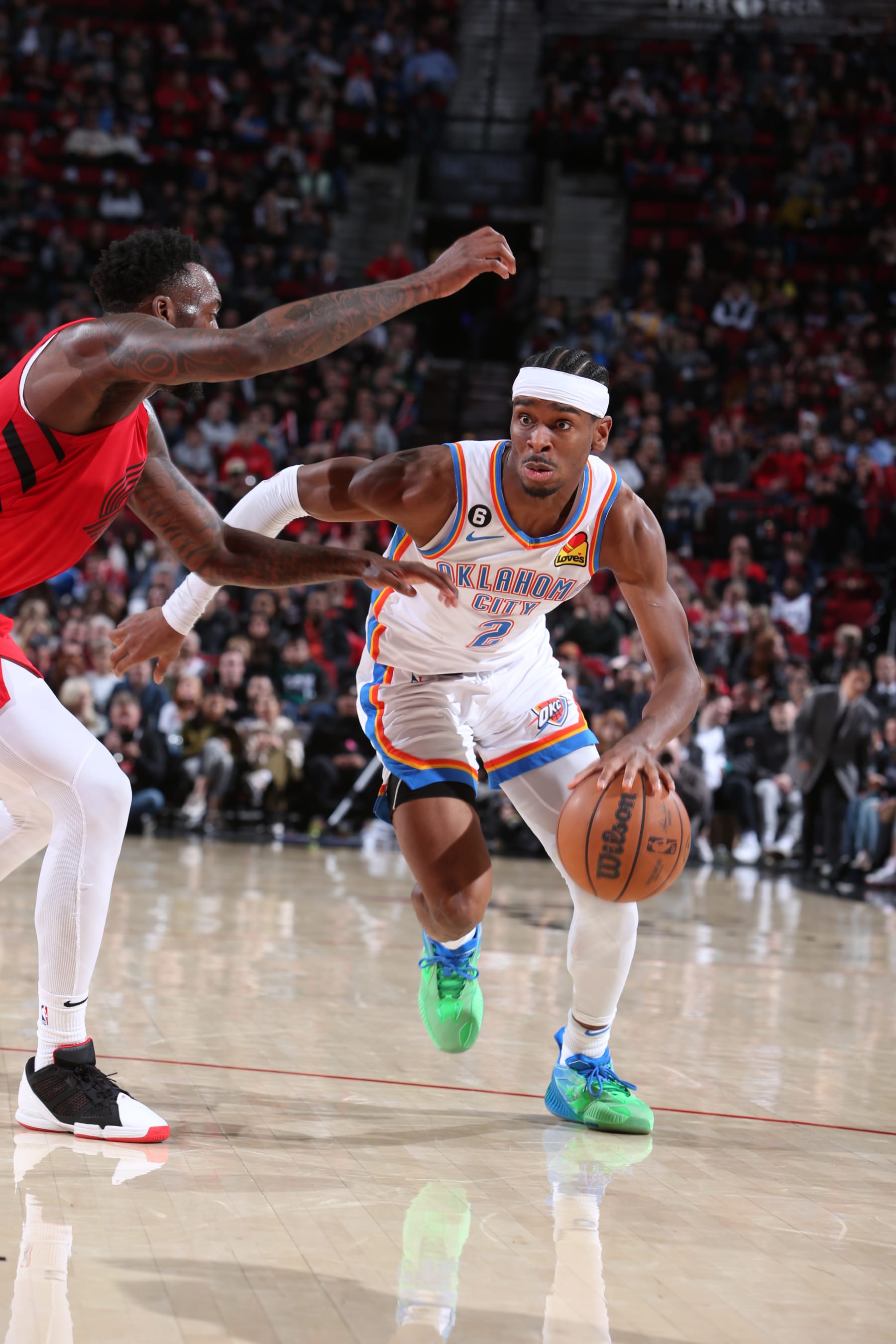 PORTLAND, OR - MARCH 26: Shai Gilgeous-Alexander #2 of the Oklahoma City Thunder dribbles the ball during the game against the Portland Trail Blazers on March 26, 2023 at the Moda Center Arena in Portland, Oregon. NOTE TO USER: User expressly acknowledges and agrees that, by downloading and or using this photograph, user is consenting to the terms and conditions of the Getty Images License Agreement. Mandatory Copyright Notice: Copyright 2023 NBAE (Photo by Sam Forencich/NBAE via Getty Images)