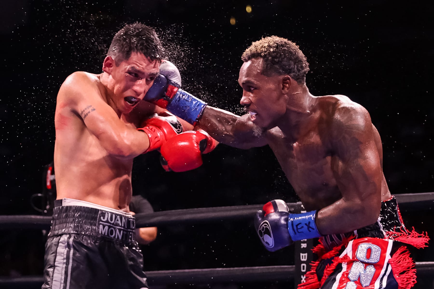 HOUSTON, TEXAS - JUNE 19: Jermall Charlo and Juan Macias Montiel exchange punches during their WBC middleweight title fight at Toyota Center on June 19, 2021 in Houston, Texas. (Photo by Carmen Mandato/Getty Images)