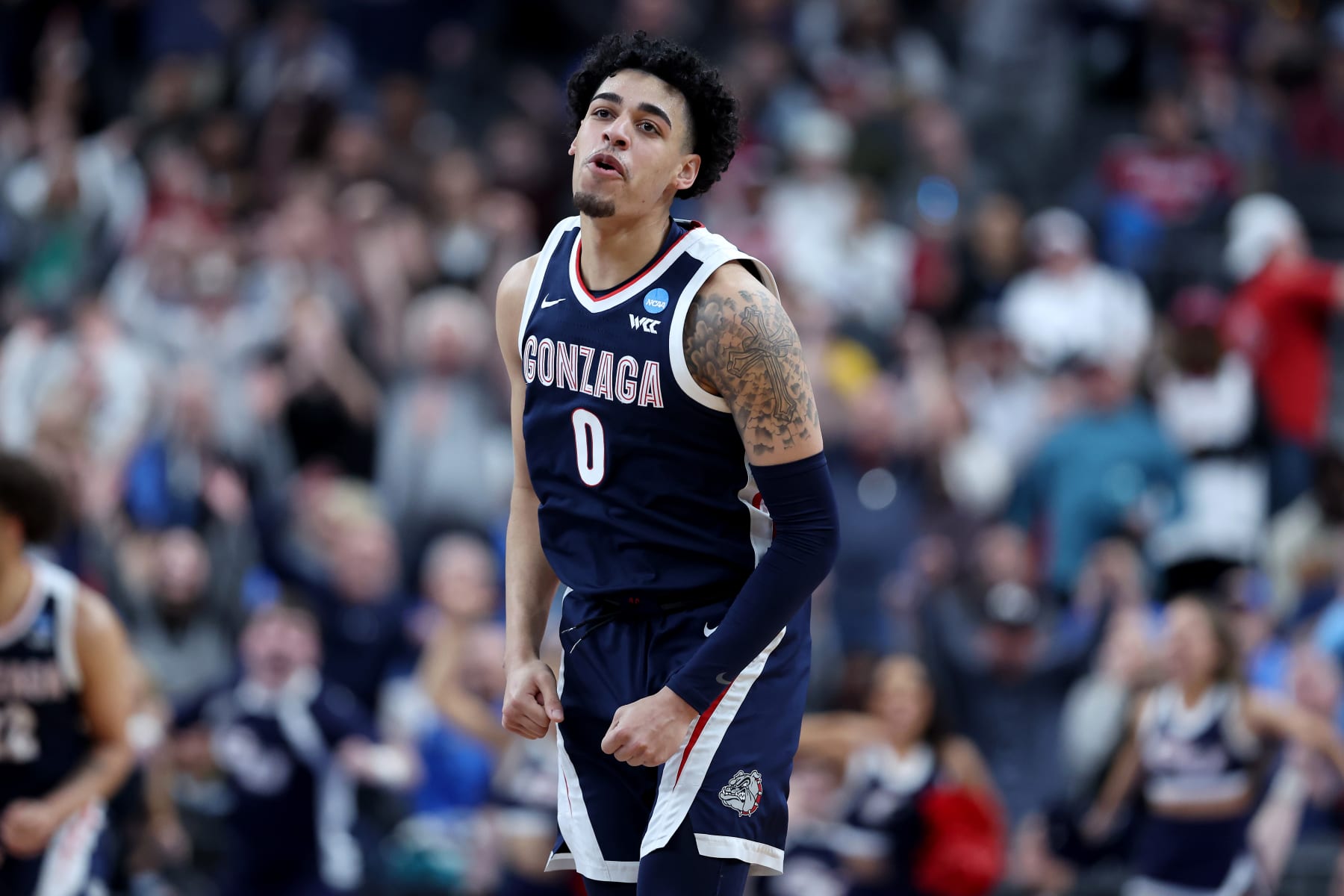 LAS VEGAS, NEVADA - MARCH 23: Julian Strawther #0 of the Gonzaga Bulldogs reacts after scoring a three-point basket against the UCLA Bruins during the second half in the Sweet 16 round of the NCAA Men's Basketball Tournament at T-Mobile Arena on March 23, 2023 in Las Vegas, Nevada. (Photo by Sean M. Haffey/Getty Images)