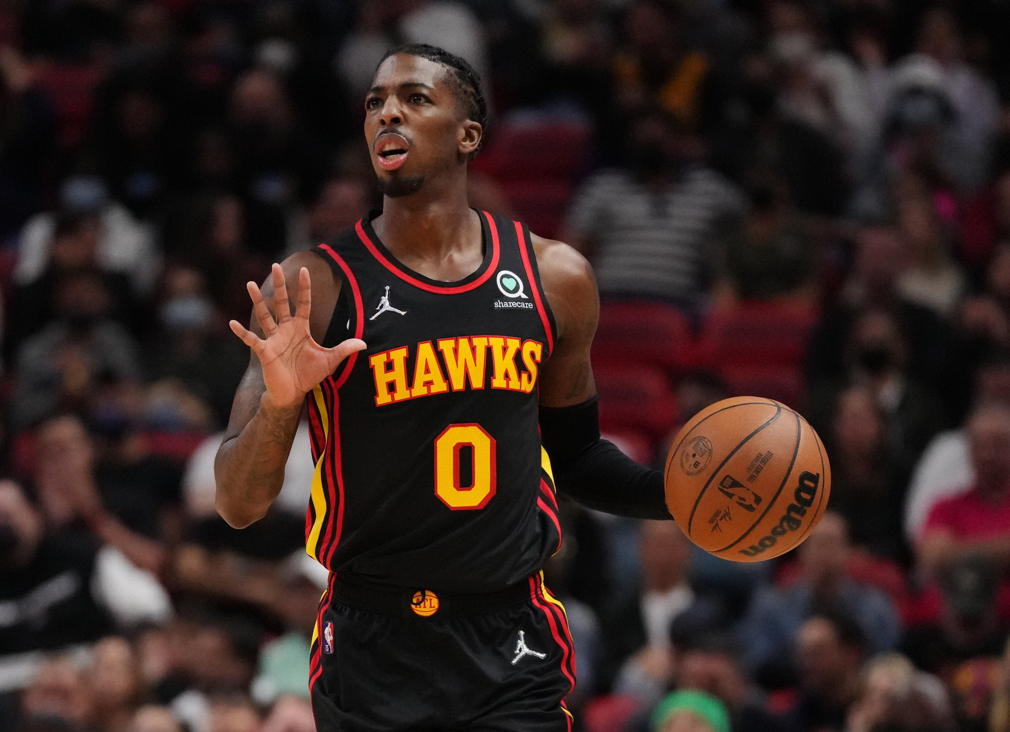 MIAMI, FLORIDA - JANUARY 14: Delon Wright #0 of the Atlanta Hawks controls the ball against the Miami Heat in the first half at FTX Arena on January 14, 2022 in Miami, Florida. NOTE TO USER: User expressly acknowledges and agrees that, by downloading and or using this photograph, User is consenting to the terms and conditions of the Getty Images License Agreement. (Photo by Mark Brown/Getty Images)