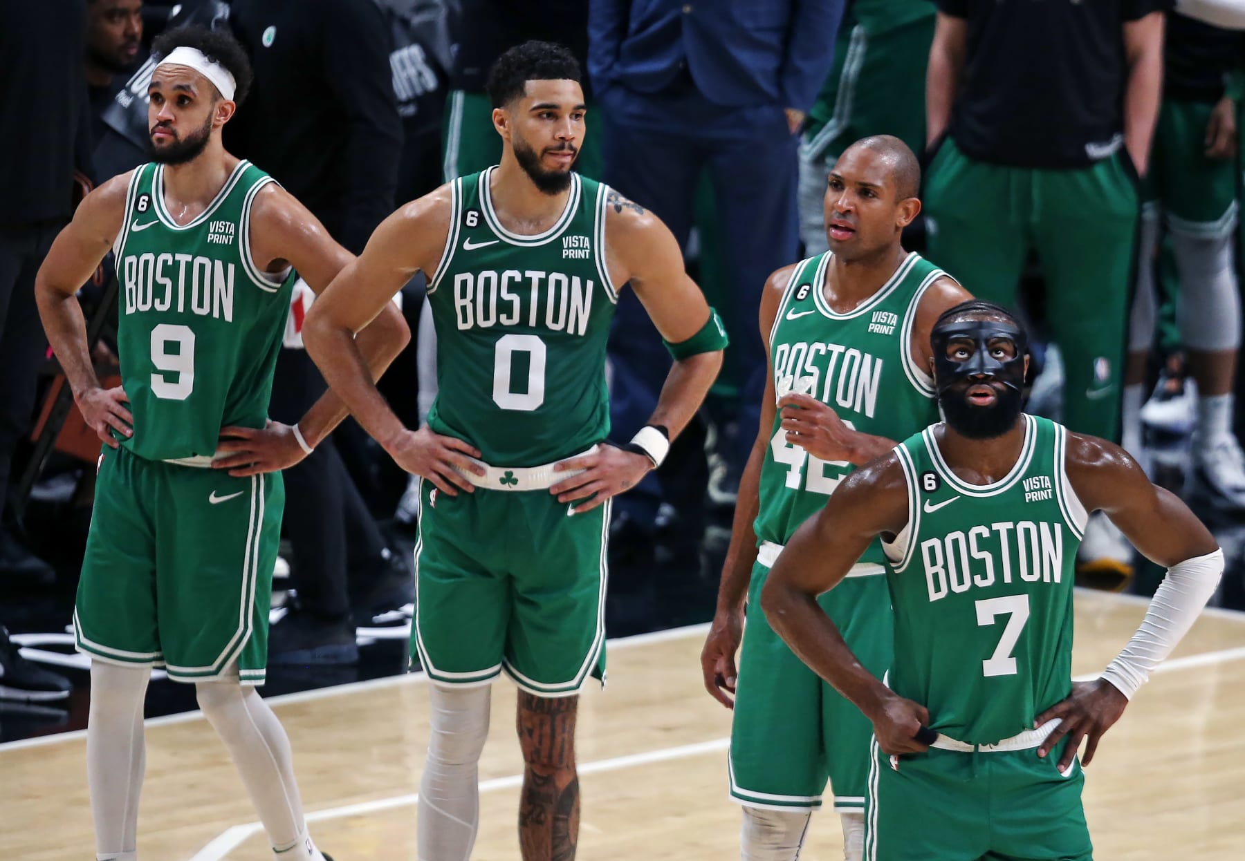 Atlanta, GA - April 21: Boston Celtics, from left to right, Derrick White, Jayson Tatum, Al Horford and Jaylen Brown stand on the court in the final moments of the fourth quarter. The Celtics lost to the Atlanta Hawks, 130-122, in Game 3 of their Eastern Conference First Round Series. (Photo by Jim Davis/The Boston Globe via Getty Images)