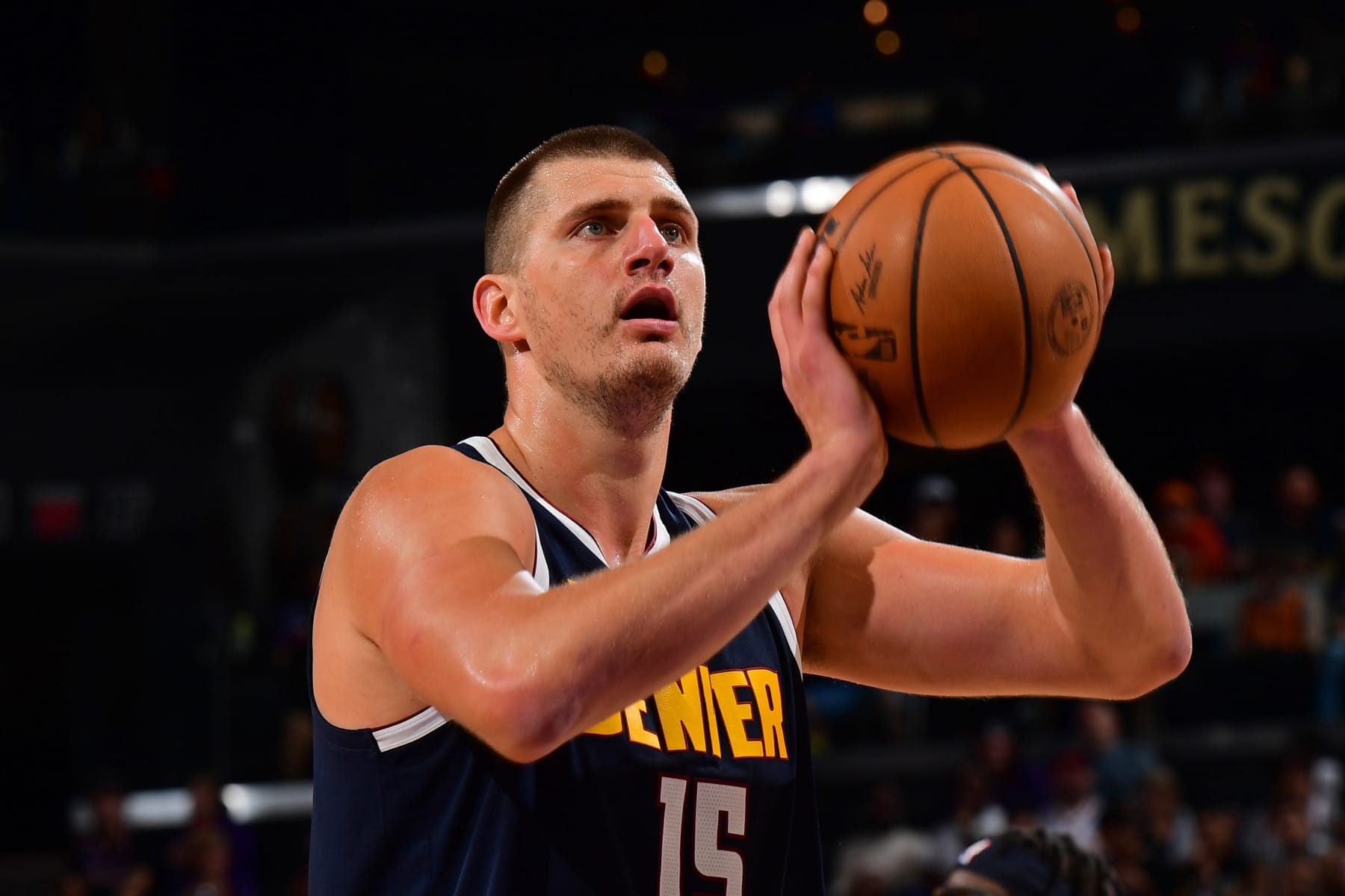 PHOENIX, AZ - OCTOBER  10: Nikola Jokic #15 of the Denver Nuggets shoots a free throw during the game against the Phoenix Suns on October 10, 2023 at Footprint Center in Phoenix, Arizona. NOTE TO USER: User expressly acknowledges and agrees that, by downloading and or using this photograph, user is consenting to the terms and conditions of the Getty Images License Agreement. Mandatory Copyright Notice: Copyright 2023 NBAE (Photo by Kate Frese/NBAE via Getty Images)