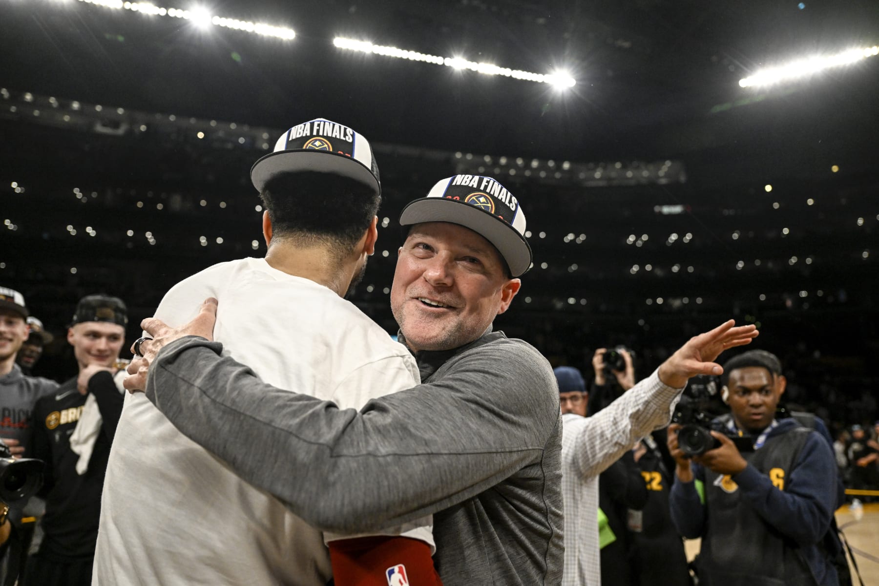 LOS ANGELES, CA - MAY 22: Denver Nuggets head coach Michael Malone hugs Jamal Murray (27) after the fourth quarter of the Nuggets' 113-111 Western Conference finals game 4 win over the Los Angeles Lakers at Crypto.com Arena in Los Angeles on Monday, May 22, 2023. The Nuggets swept the best-of-seven series 4-0 to advance to their first NBA Finals in franchise history. (Photo by AAron Ontiveroz/The Denver Post)