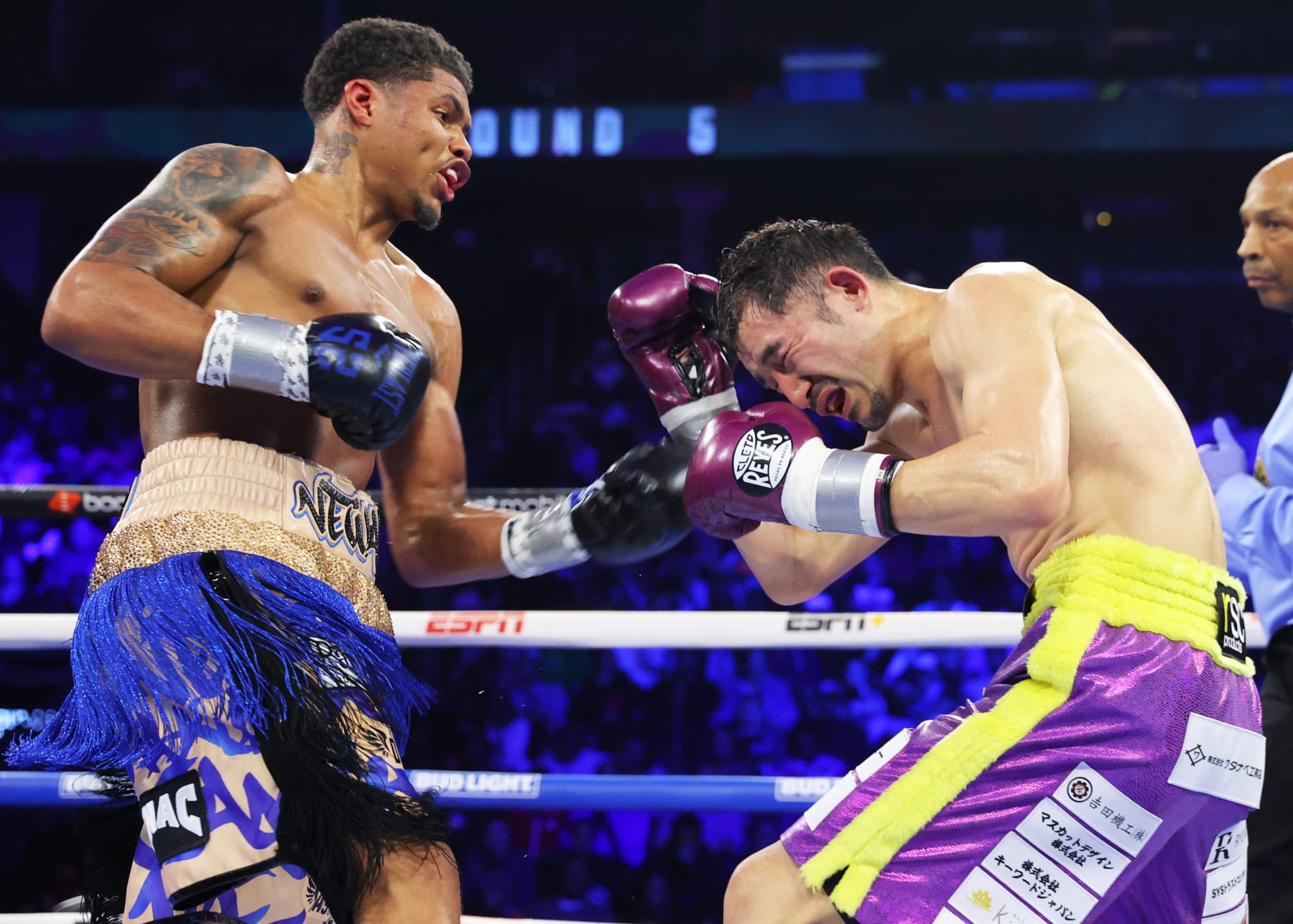 NEWARK, NEW JERSEY - APRIL 08: Shakur Stevenson (L) and Shuichiro Yoshino (R) exchange punches during their lightweight fight at Prudential Center on April 08, 2023 in Newark, New Jersey. (Photo by Mikey Williams/Top Rank Inc via Getty Images)