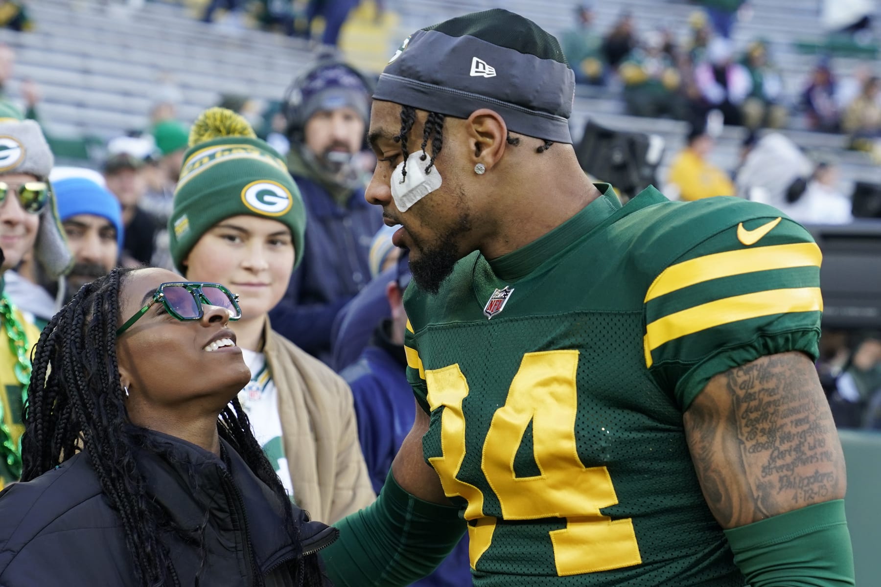 GREEN BAY, WISCONSIN - NOVEMBER 19: Jonathan Owens #34 of the Green Bay Packers meets with wife Simone Biles before the game against the Los Angeles Chargers at Lambeau Field on November 19, 2023 in Green Bay, Wisconsin. (Photo by Patrick McDermott/Getty Images)