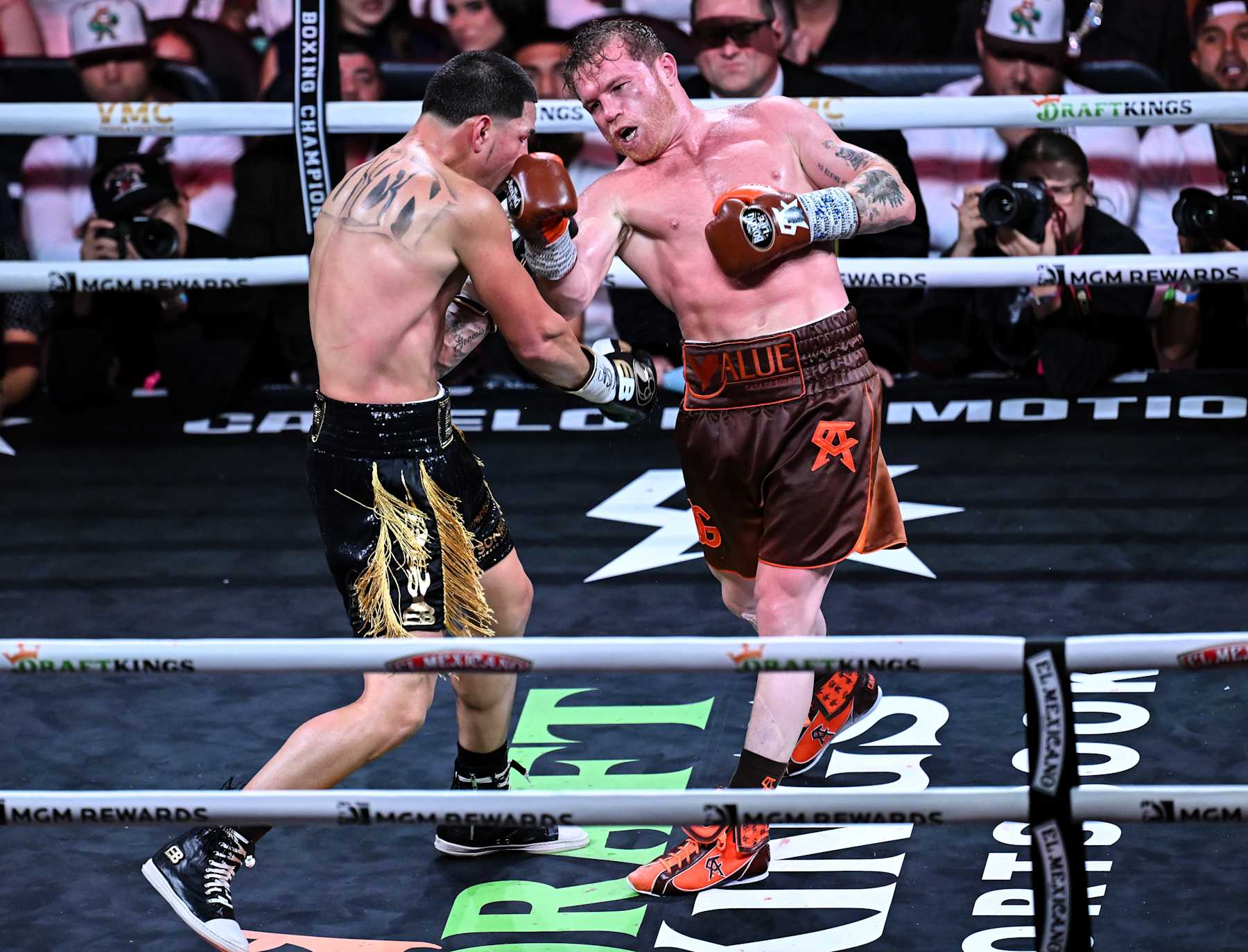 LAS VEGAS, NEVADA - SEPTEMBER 14: Saul 'Canelo' Alvarez (in brown short) from Guadalajara, Mexico and Edgar Berlanga (in black&gold short) from Brooklyn, New York exchange punches during their super middleweight world titles of the Premiere Boxing Championship on Saturday night at the T-Mobile Arena in Las Vegas, Nevada, United States on September 14, 2024. (Photo by Tayfun Coskun/Anadolu via Getty Images)