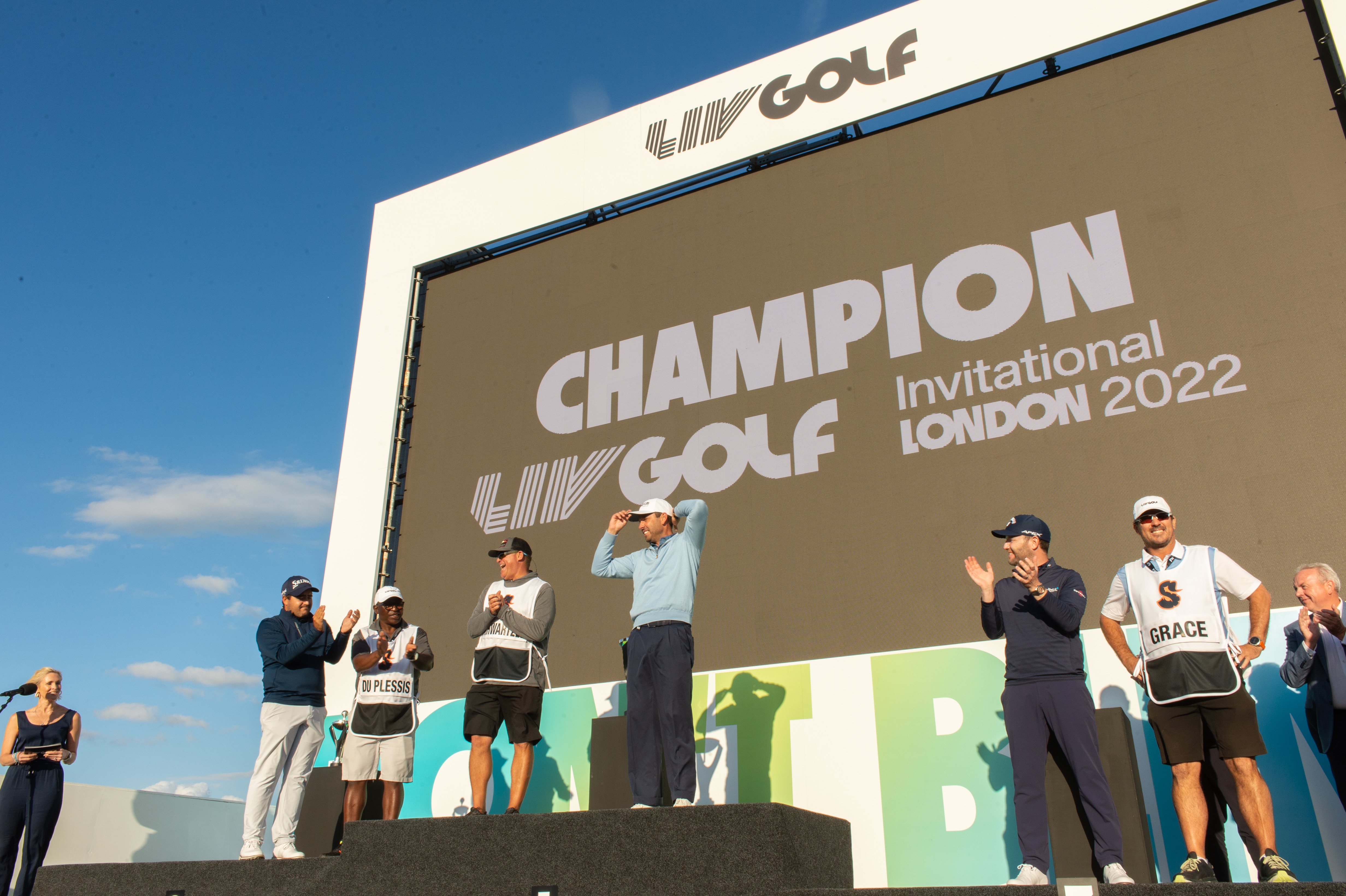 ST ALBANS, ENGLAND - JUNE 11: Team Stinger GC (L-R) celebrate Hennie du Plessis of South Africa, Charl Schwartzel of South Africa and Branden Grace of South Africa after the final round of the Inaugural LIV Golf Invitational at The Centurion Club on June 11, 2022 in St Albans, England. (Photo by Montana Pritchard/LIV Golf/Getty Images)
