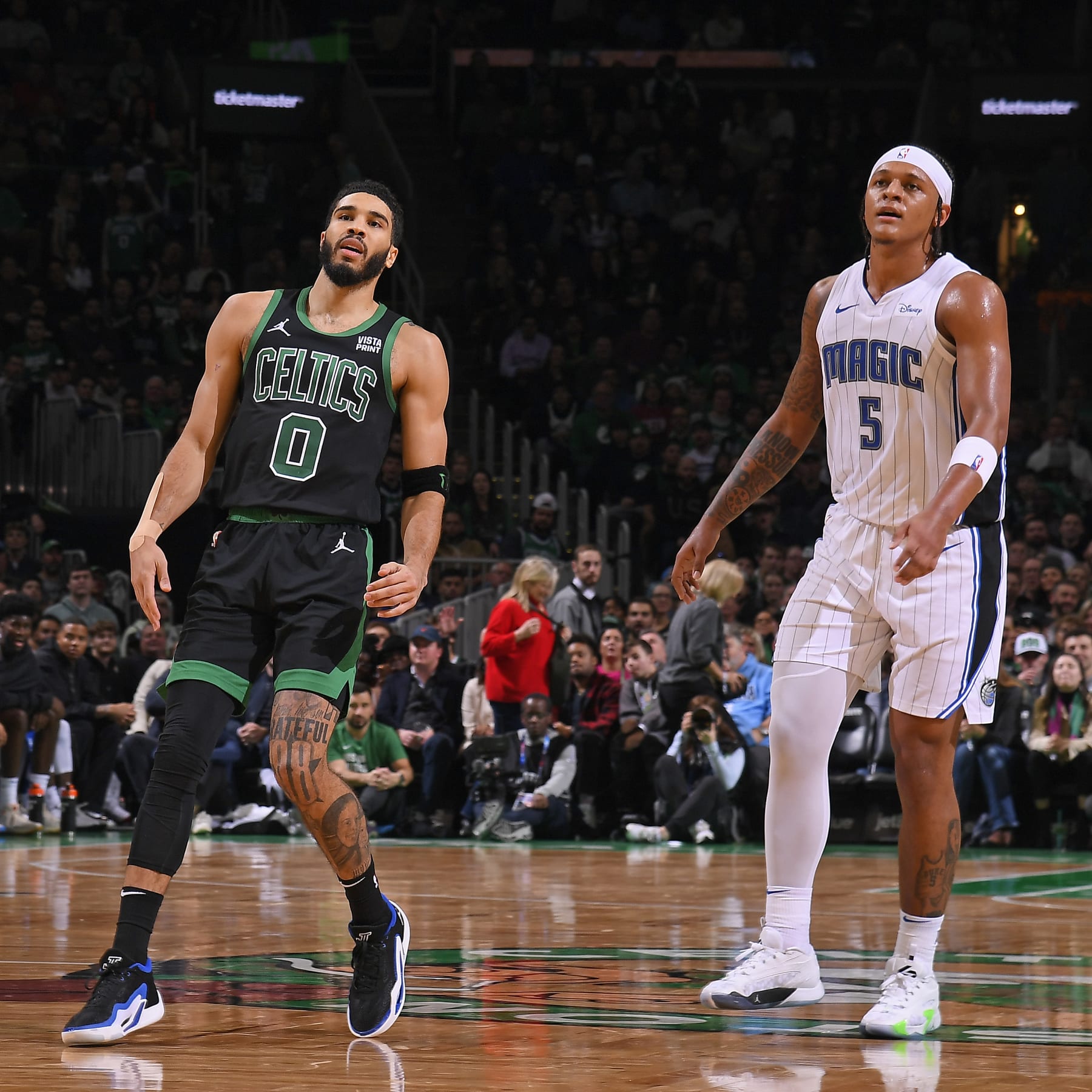 BOSTON, MA - DECEMBER 15: Jayson Tatum #0 of the Boston Celtics and Paolo Banchero #5 of the Orlando Magic look on during the game on December 15, 2023 at the TD Garden in Boston, Massachusetts. NOTE TO USER: User expressly acknowledges and agrees that, by downloading and or using this photograph, User is consenting to the terms and conditions of the Getty Images License Agreement. Mandatory Copyright Notice: Copyright 2023 NBAE  (Photo by Brian Babineau/NBAE via Getty Images)