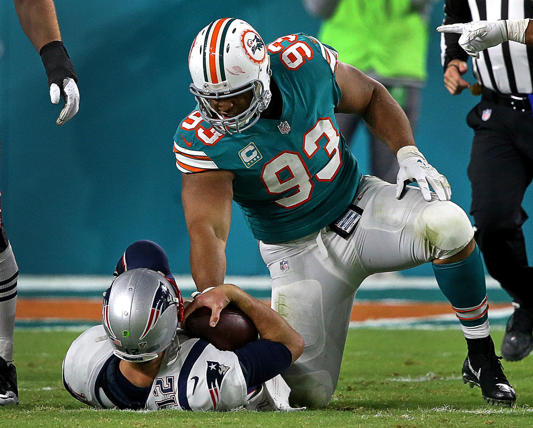 MIAMI GARDENS, FL - DECEMBER 12: Miami Dolphins defensive tackle Ndamukong Suh (93) sacks New England Patriots quarterback Tom Brady (12) during the fourth quarter of a game at the Hard Rock Stadium in Miami Gardens, Fl., Dec. 11, 2017. (Photo by Barry Chin/The Boston Globe via Getty Images)