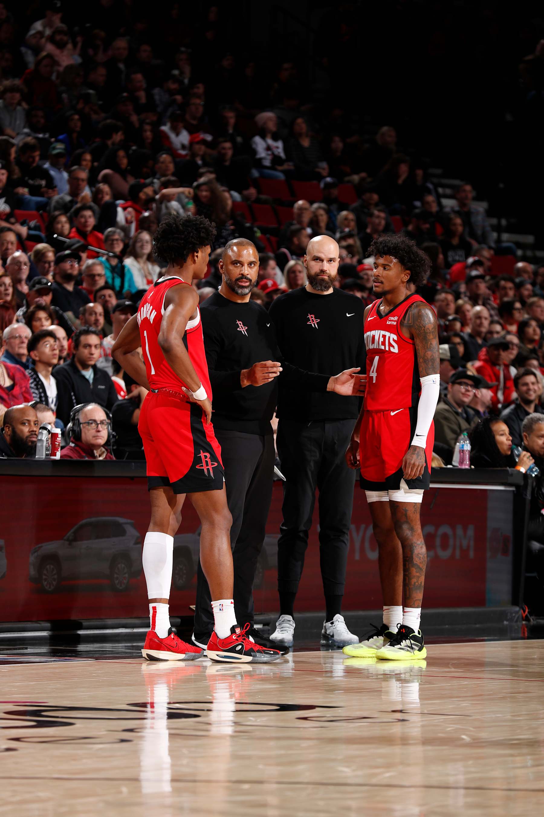 PORTLAND, OR - MARCH 8:  Amen Thompson #1 of the Houston Rockets, Head Coach Ime Udoka of the Houston Rockets, Assistant Coach Ben Sullivan of the Houston Rockets & Jalen Green #4 of the Houston Rockets looks on during the game on March 8, 2024 at the Moda Center Arena in Portland, Oregon. NOTE TO USER: User expressly acknowledges and agrees that, by downloading and or using this photograph, user is consenting to the terms and conditions of the Getty Images License Agreement. Mandatory Copyright Notice: Copyright 2024 NBAE (Photo by Cameron Browne/NBAE via Getty Images)