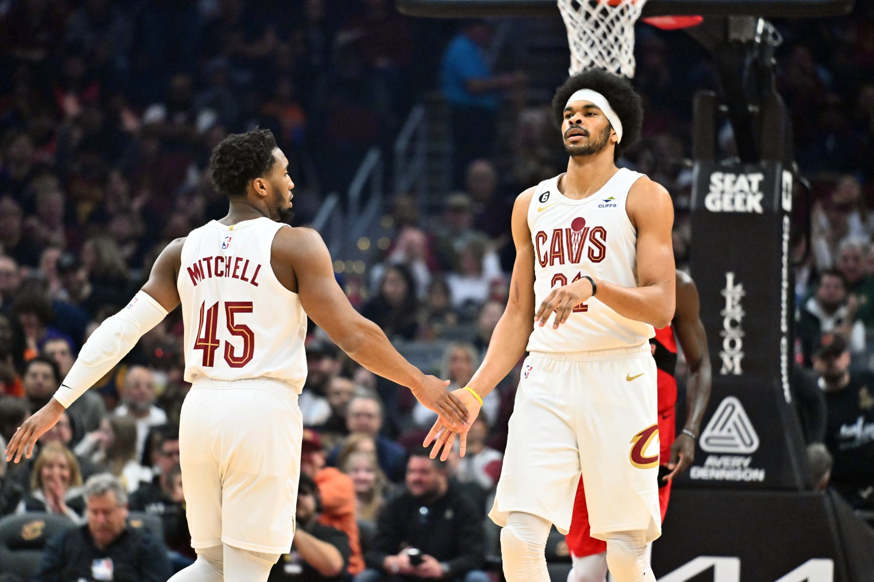 CLEVELAND, OHIO - FEBRUARY 26: Donovan Mitchell #45 celebrates with Jarrett Allen #31 of the Cleveland Cavaliers during the first quarter against the Toronto Raptors at Rocket Mortgage Fieldhouse on February 26, 2023 in Cleveland, Ohio. NOTE TO USER: User expressly acknowledges and agrees that, by downloading and or using this photograph, User is consenting to the terms and conditions of the Getty Images License Agreement. (Photo by Jason Miller/Getty Images)