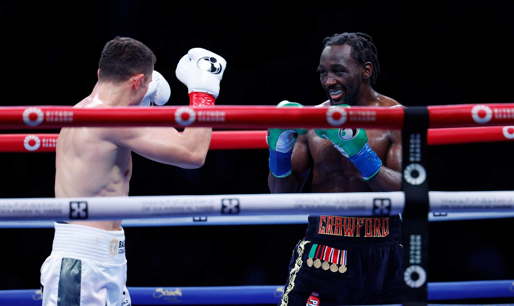 LOS ANGELES, CALIFORNIA - AUGUST 3: Terence Crawford smiles at Israel Madrimov during the tenth round of the WBA junior middleweight title bout at BMO Stadium on August 3, 2024 in Los Angeles, California. (Photo by Kevork Djansezian/Getty Images)