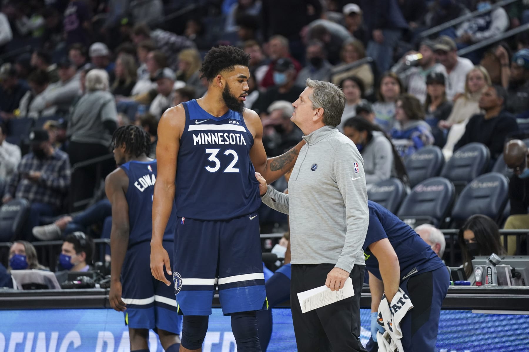 MINNEAPOLIS, MN -  NOVEMBER 18: Karl-Anthony Towns #32 of the Minnesota Timberwolves talks to Head Coach Chris Finch of the Minnesota Timberwolves during the game against the San Antonio Spurs on November 18, 2021 at Target Center in Minneapolis, Minnesota. NOTE TO USER: User expressly acknowledges and agrees that, by downloading and or using this Photograph, user is consenting to the terms and conditions of the Getty Images License Agreement. Mandatory Copyright Notice: Copyright 2021 NBAE (Photo by Jordan Johnson/NBAE via Getty Images)
