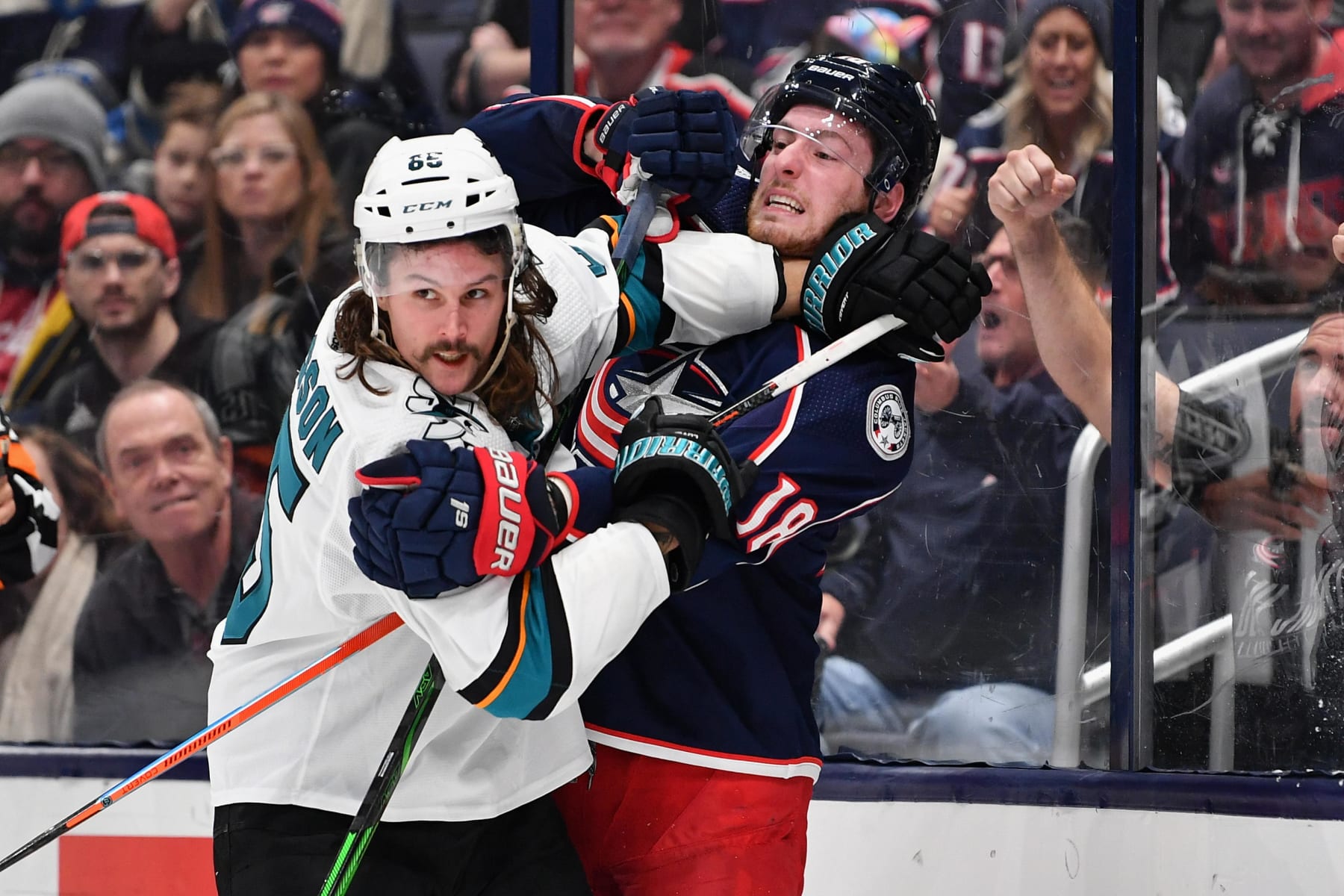 COLUMBUS, OH - JANUARY 4:  Erik Karlsson #65 of the San Jose Sharks and Pierre-Luc Dubois #18 of the Columbus Blue Jackets battle for position on January 4, 2020 at Nationwide Arena in Columbus, Ohio.  (Photo by Jamie Sabau/NHLI via Getty Images)