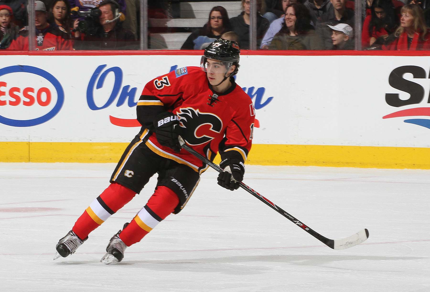 CALGARY, AB - DECEMBER 29: Johnny Gaudreau #13 of the Calgary Flames skates against the Los Angeles Kings at Scotiabank Saddledome on December 29, 2014 in Calgary, Alberta, Canada. (Photo by Brad Watson/NHLI via Getty Images) 