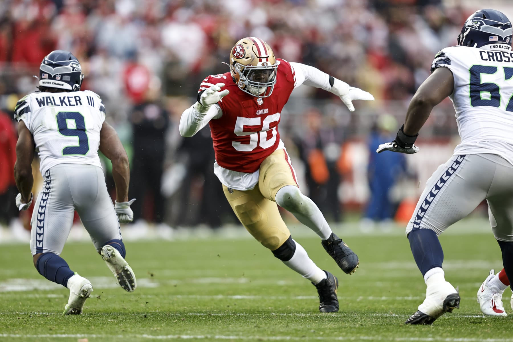 SANTA CLARA, CALIFORNIA - JANUARY 14: Samson Ebukam #56 of the San Francisco 49ers rushes the quarterback during an NFL football game between the San Francisco 49ers and the Seattle Seahawks at Levi's Stadium on January 14, 2023 in Santa Clara, California. (Photo by Michael Owens/Getty Images)