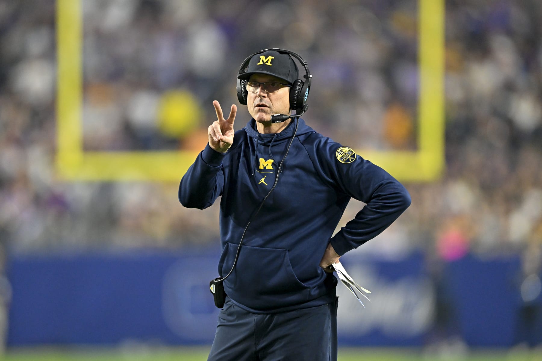 GLENDALE, ARIZONA - DECEMBER 31: Head coach Jim Harbaugh of the Michigan Wolverines calls for a two point conversion during the third quarter of the College Football Playoff Semifinal Fiesta Bowl football game against the TCU Horned Frogs at State Farm Stadium on December 31, 2022 in Glendale, Arizona. The TCU Horned Frogs won 51-45. (Photo by Alika Jenner/Getty Images)