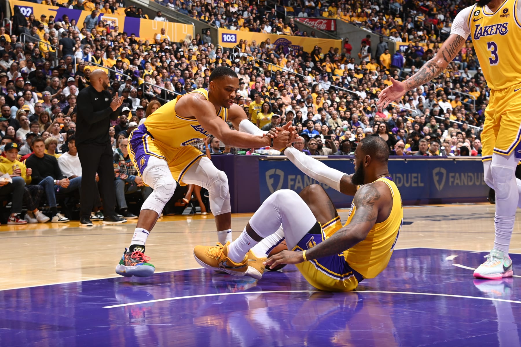 LOS ANGELES, CA - OCTOBER 20: Russell Westbrook #0 helps LeBron James #6 of the Los Angeles Lakers during the game against the LA Clippers on October 20, 2022 at Crypto.com Arena in Los Angeles, California. NOTE TO USER: User expressly acknowledges and agrees that, by downloading and/or using this Photograph, user is consenting to the terms and conditions of the Getty Images License Agreement. Mandatory Copyright Notice: Copyright 2022 NBAE (Photo by Andrew D. Bernstein/NBAE via Getty Images)