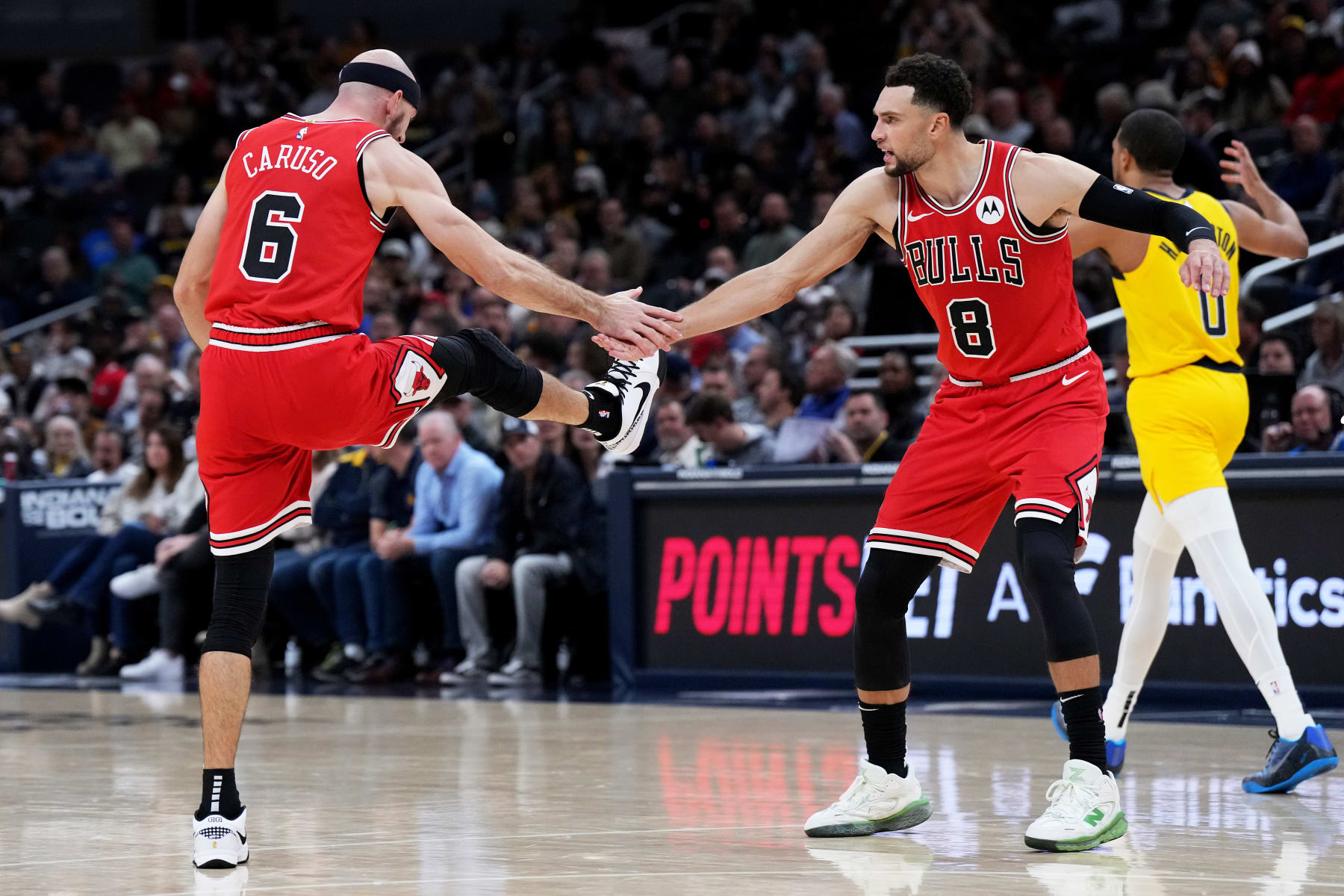 INDIANAPOLIS, INDIANA - OCTOBER 30: Alex Caruso #6 of the Chicago Bulls celebrates his dunk with Zach LaVine #8 during the second half against the Indiana Pacers at Gainbridge Fieldhouse on October 30, 2023 in Indianapolis, Indiana. NOTE TO USER: User expressly acknowledges and agrees that, by downloading and or using this photograph, User is consenting to the terms and conditions of the Getty Images License Agreement. (Photo by Emilee Chinn/Getty Images)