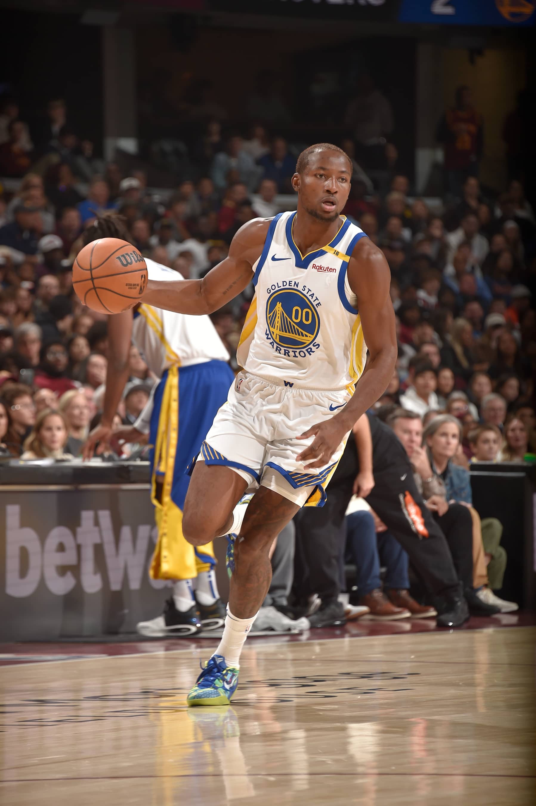 CLEVELAND, OH - NOVEMBER 8: Jonathan Kuminga #00 of the Golden State Warriors dribbles the ball during the game against the Cleveland Cavaliers   during a regular season game on November 8, 2024 at Rocket Mortgage FieldHouse in Cleveland, Ohio. NOTE TO USER: User expressly acknowledges and agrees that, by downloading and/or using this Photograph, user is consenting to the terms and conditions of the Getty Images License Agreement. Mandatory Copyright Notice: Copyright 2024 NBAE (Photo by David Liam Kyle/NBAE via Getty Images)