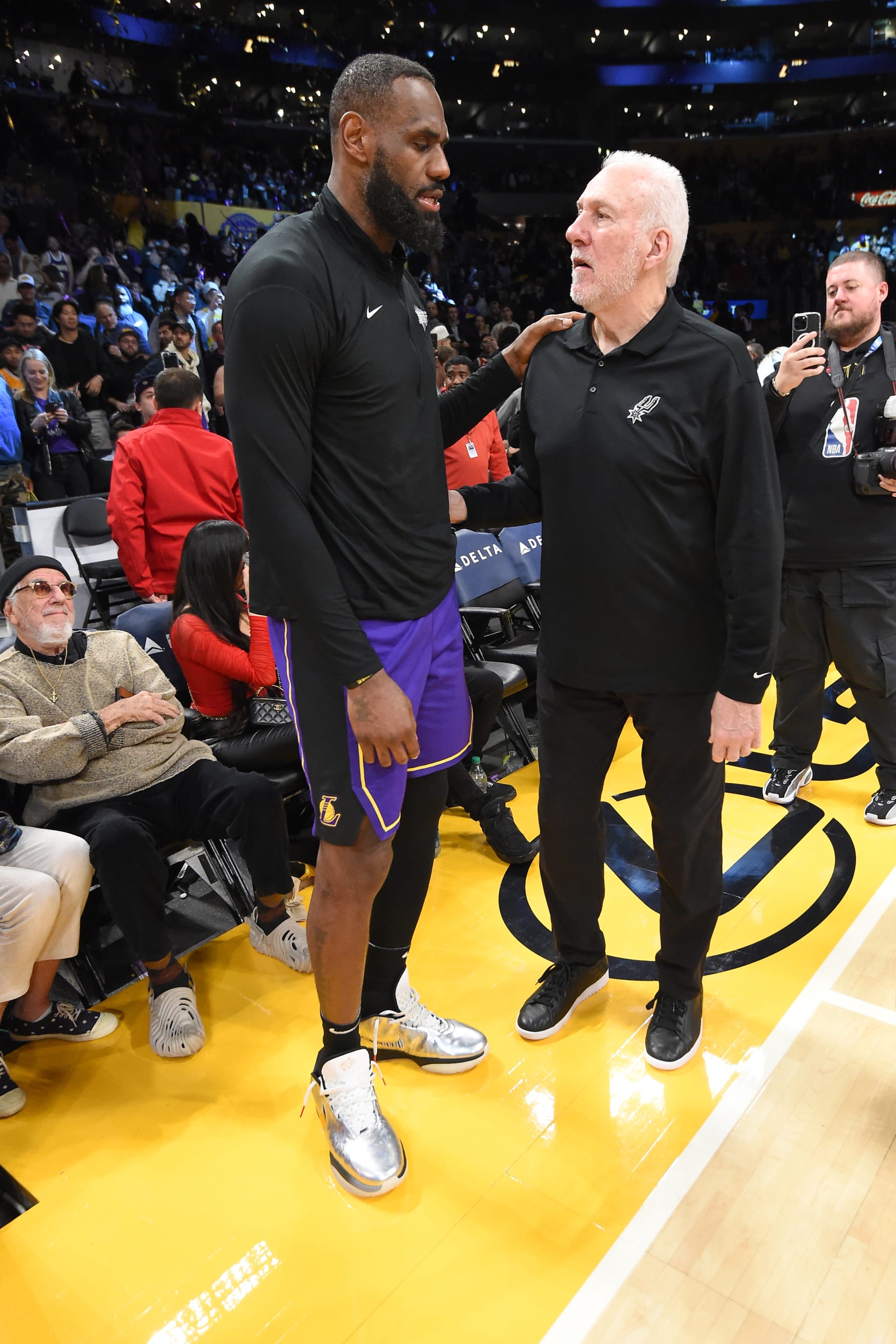 LOS ANGELES, CA - FEBRUARY 23:  LeBron James #23 of the Los Angeles Lakers & Head Coach Gregg Popovich of the San Antonio Spurs embrace after the game  on February 23, 2024 at Crypto.Com Arena in Los Angeles, California. NOTE TO USER: User expressly acknowledges and agrees that, by downloading and/or using this Photograph, user is consenting to the terms and conditions of the Getty Images License Agreement. Mandatory Copyright Notice: Copyright 2024 NBAE (Photo by Andrew D. Bernsteini/NBAE via Getty Images)
