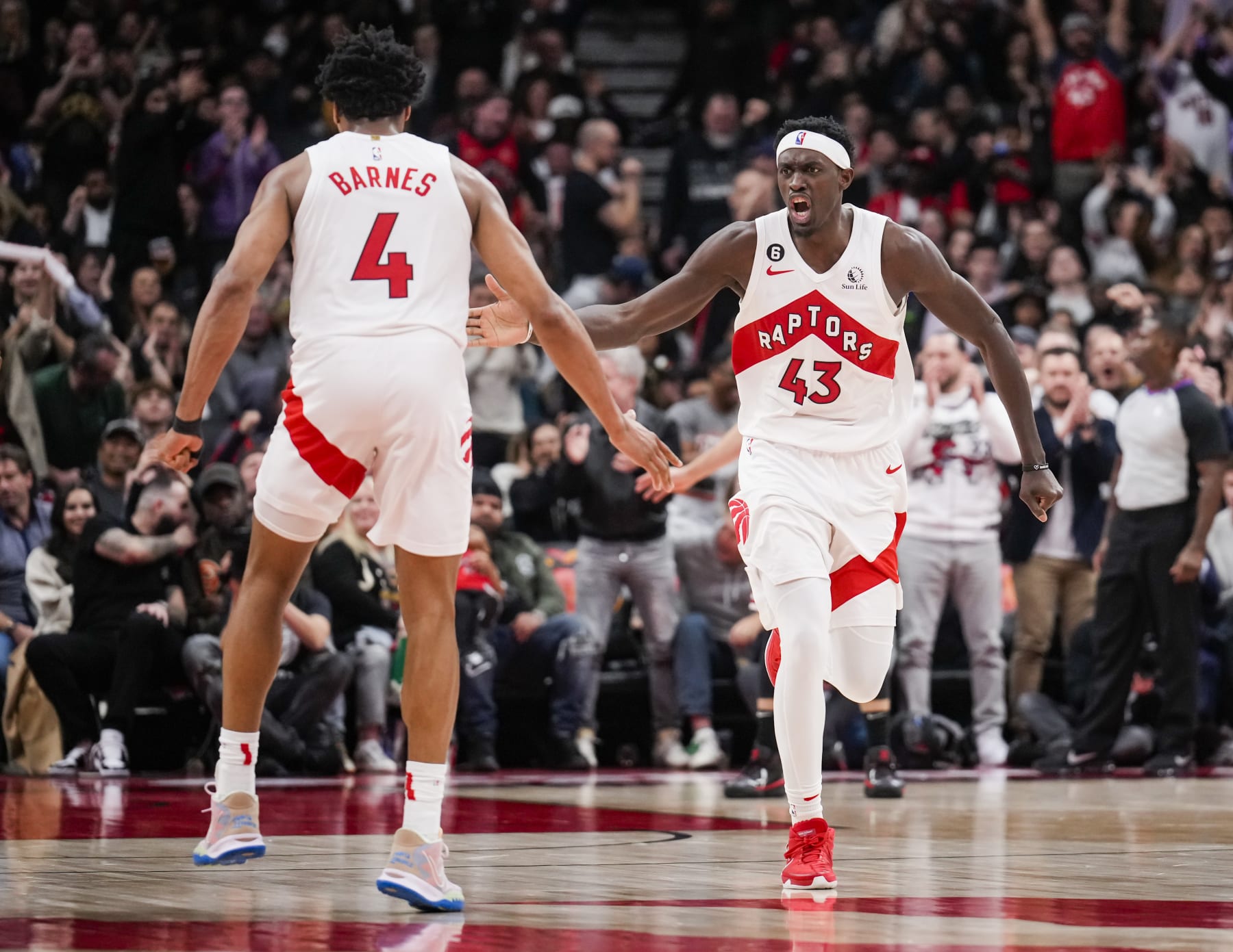 TORONTO, ON - FEBRUARY 28: Pascal Siakam #43 and Scottie Barnes #4 of the Toronto Raptors celebrate against the Chicago Bulls during the second half of their basketball game at the Scotiabank Arena on February 28, 2023 in Toronto, Ontario, Canada. NOTE TO USER: User expressly acknowledges and agrees that, by downloading and/or using this Photograph, user is consenting to the terms and conditions of the Getty Images License Agreement. (Photo by Mark Blinch/Getty Images)
