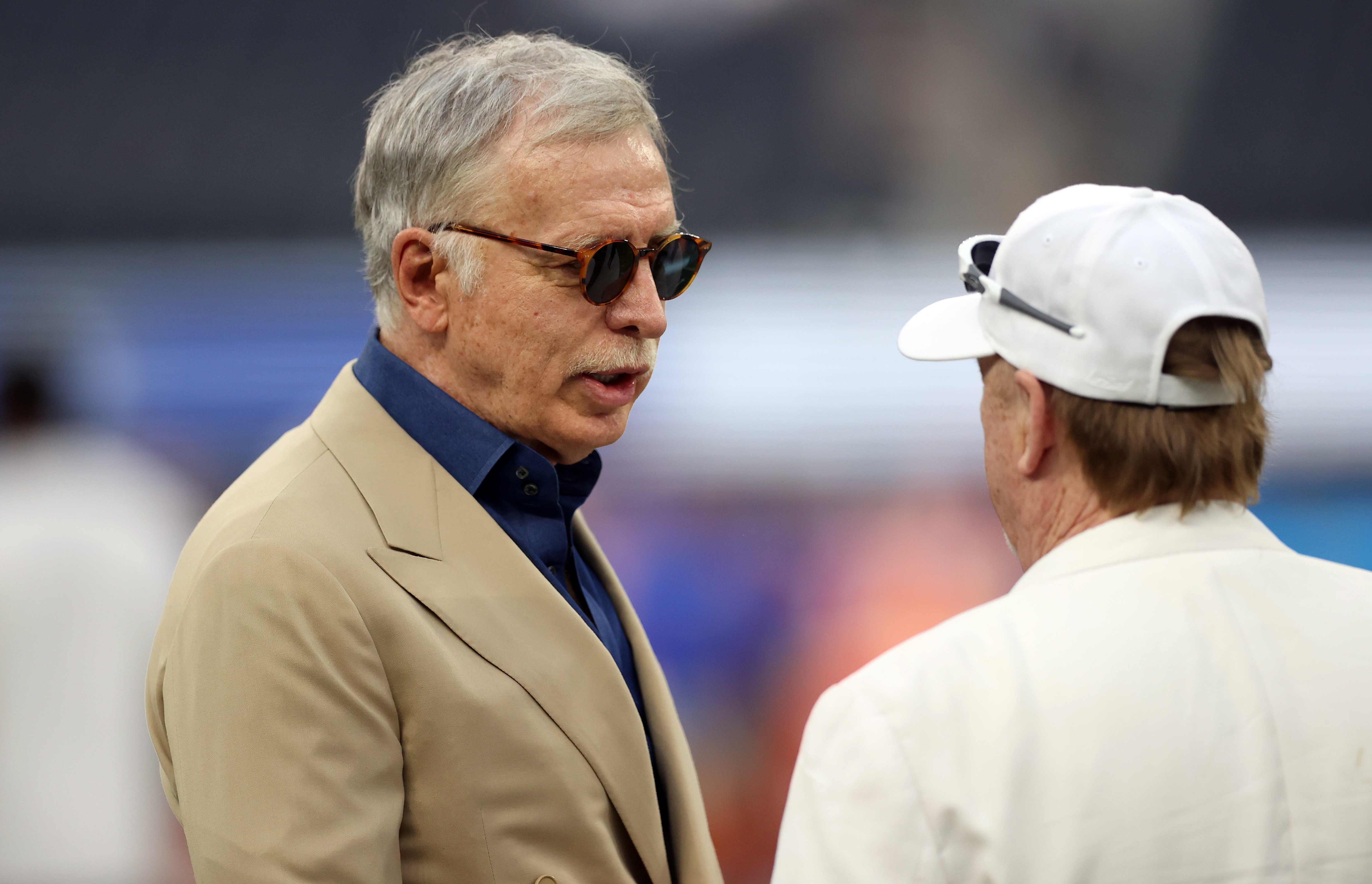 INGLEWOOD, CALIFORNIA - AUGUST 21:  Owner Stan Kroenke of the Los Angeles Rams talks with Mark Davis of the Las Vegas Raiders before a preseason NFL game at SoFi Stadium on August 21, 2021 in Inglewood, California. (Photo by Ronald Martinez/Getty Images)