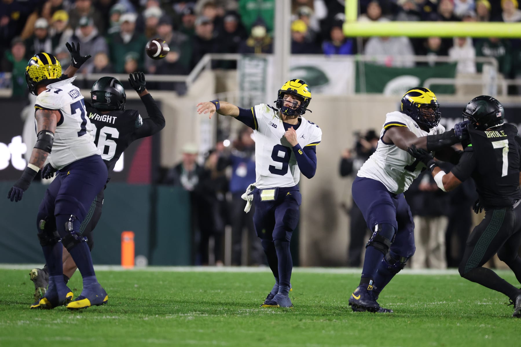 EAST LANSING, MICHIGAN - OCTOBER 21: J.J. McCarthy #9 of the Michigan Wolverines throws a first half pass against the Michigan State Spartans at Spartan Stadium on October 21, 2023 in East Lansing, Michigan. (Photo by Gregory Shamus/Getty Images)